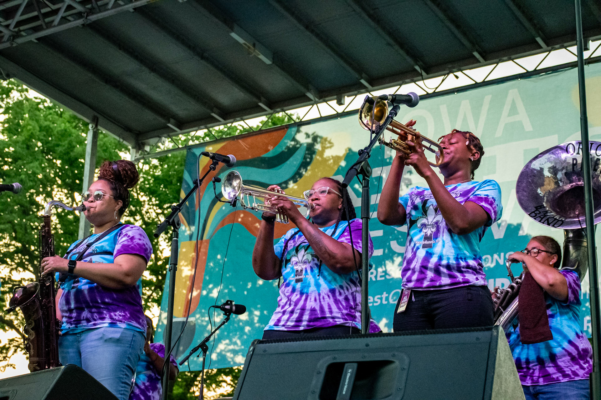 IOWA CITY, IOWA – JUNE 6, 2025: The Original Pinettes Brass Band unleashes a wall of sound at the Iowa Arts Festival, with Natasha Harris on sax, Veronique Dorsey and Jazz Henry on trumpets, and Demaries “Dee” Holmes on sousaphone. Their tight ensemble playing and undeniable charisma lit up the stage.