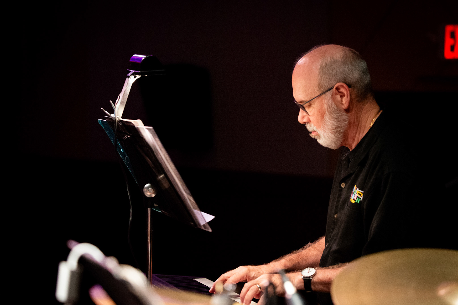 Pianist Larry Harris of the Pete Ellman Big Band focuses intently on his keys, adding harmonic depth during the band’s closing set at the Burlington Jazz Festival on July 26, 2025.