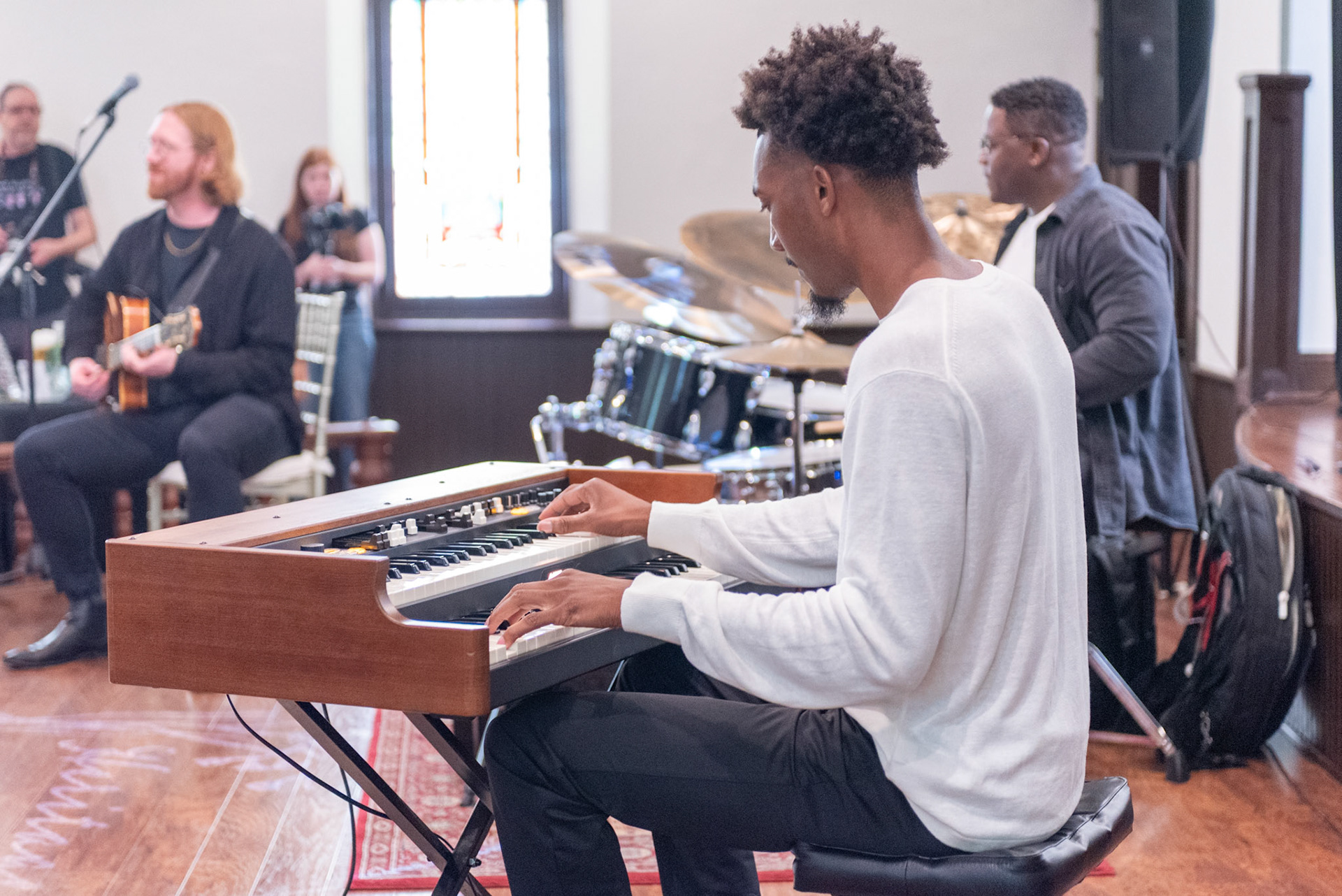 Organist Isaiah Jones Jr. drives the soulful groove of the Elisha Organ Trio, filling the Heritage Garden Event Center with rich Hammond tones during the Burlington Jazz Festival on July 26, 2025.