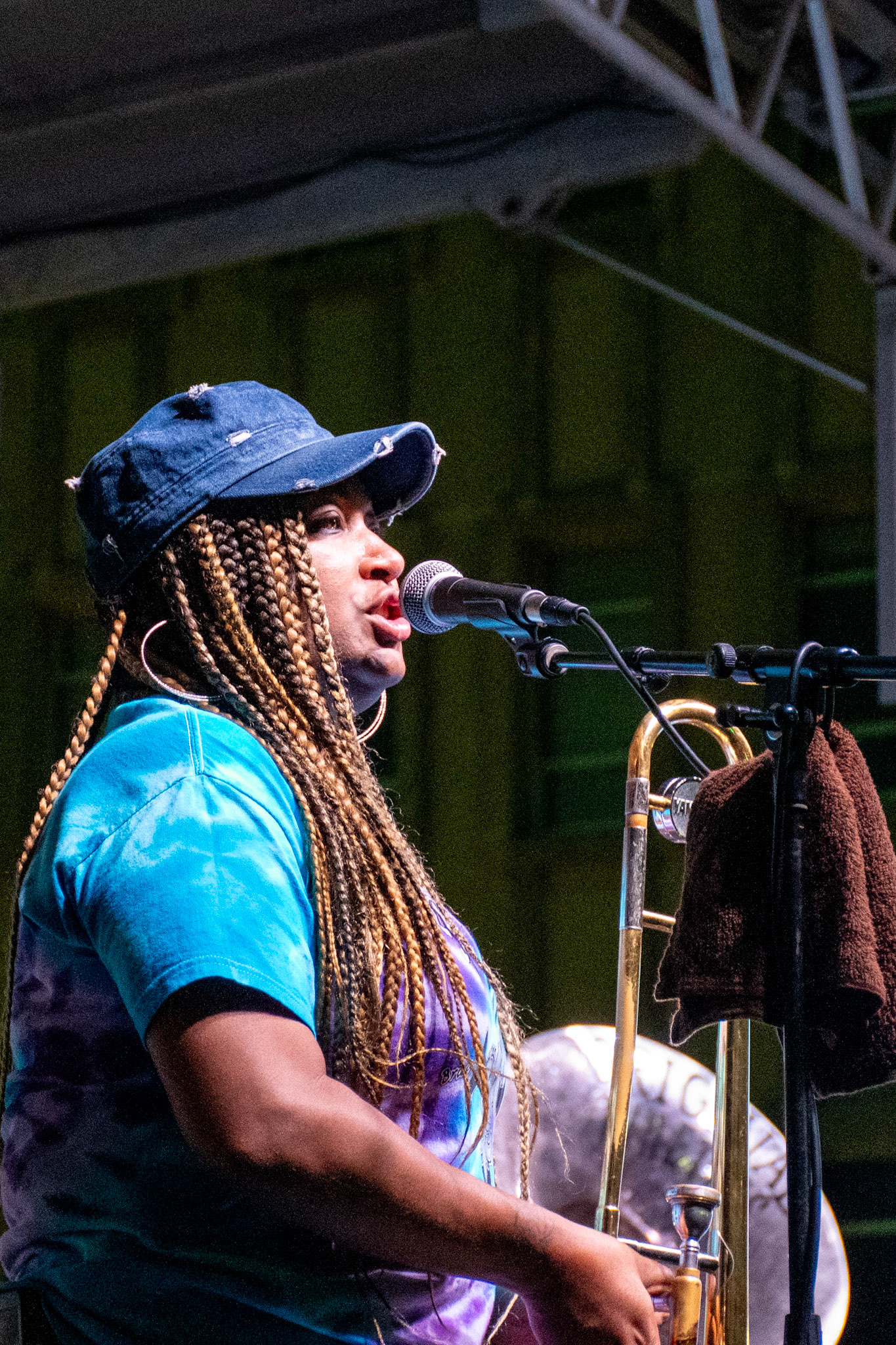 IOWA CITY, IOWA – JUNE 6, 2025: Trombonist Dionne Harrison brings commanding vocals and bold brass to the stage during The Original Pinettes Brass Band’s Iowa Arts Festival set. Her powerful presence and smooth tone added depth and soul to the band’s vibrant sound.