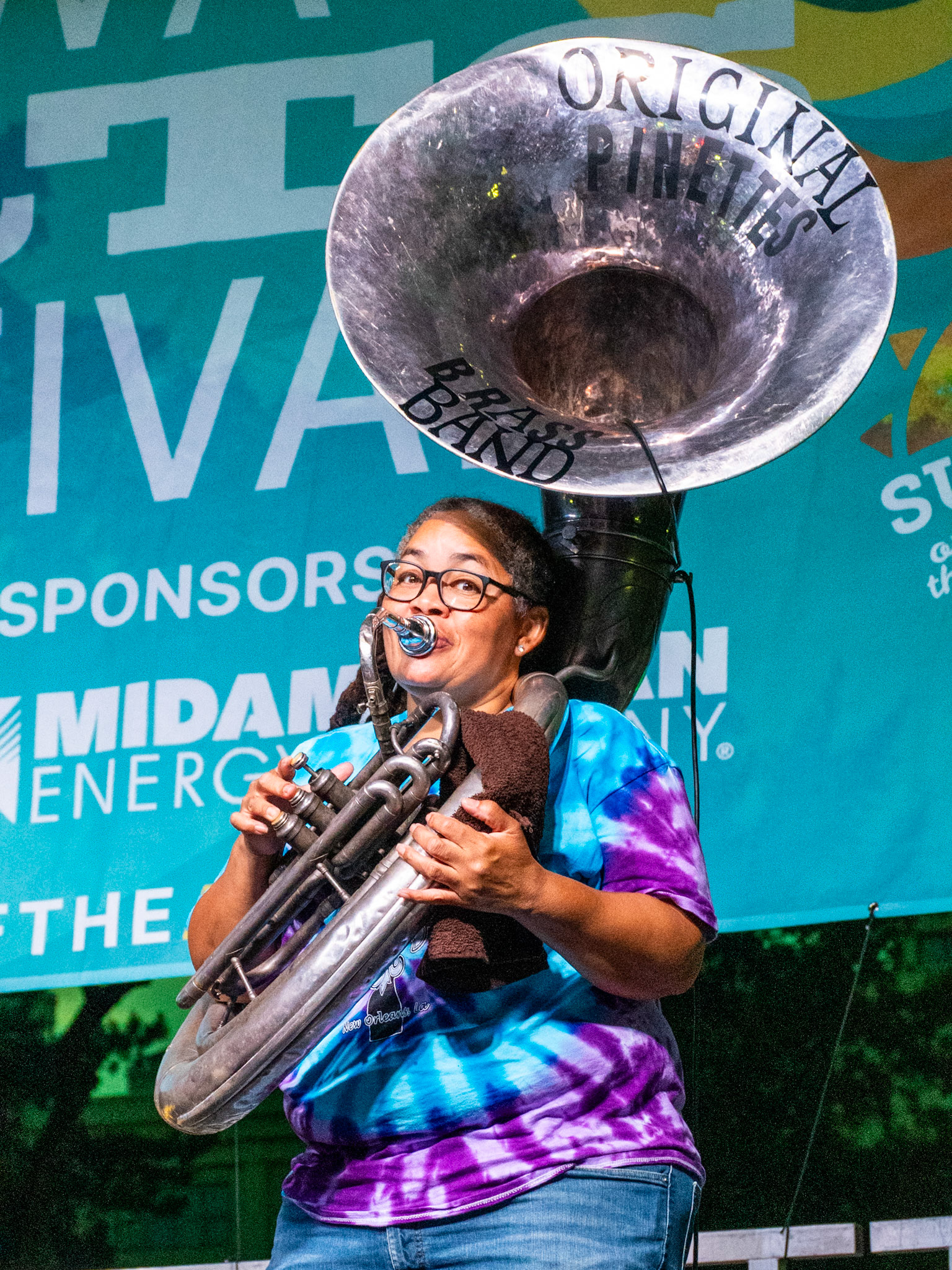 IOWA CITY, IOWA – JUNE 6, 2025: Sousaphone player Demaries “Dee” Holmes of The Original Pinettes Brass Band holds down the groove with infectious rhythm during their Iowa Arts Festival performance. Her booming low end helped drive the band’s signature New Orleans sound.