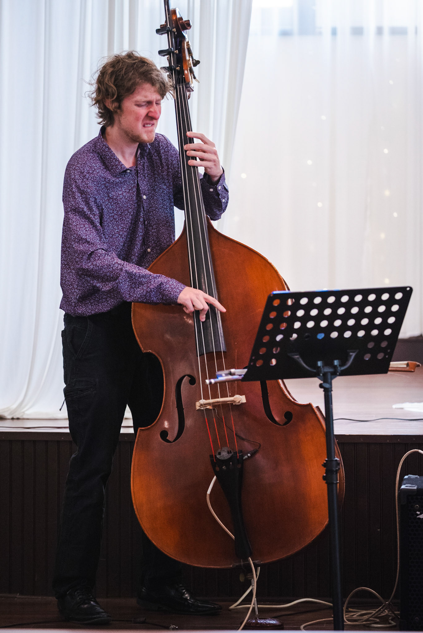 Bassist Adam Blenderman delivers an expressive performance during an impromptu trio set at the Burlington Jazz Festival on July 26, 2025.