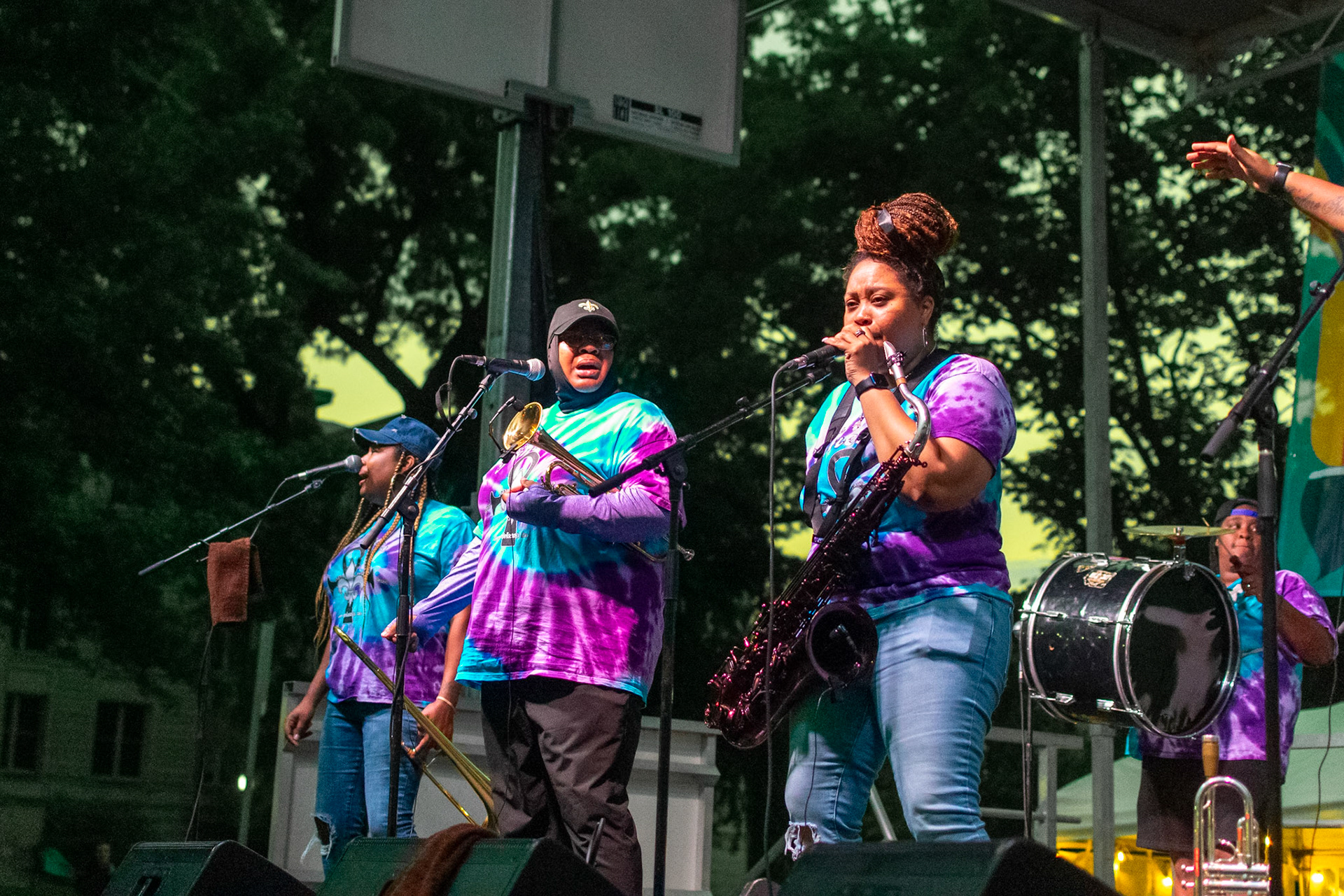 IOWA CITY, IOWA – JUNE 6, 2025: Natasha Harris, tenor saxophonist and vocalist for The Original Pinettes Brass Band, leads the charge with a bold solo during their Iowa Arts Festival set. The band’s signature energy and talent had the crowd on their feet from start to finish.