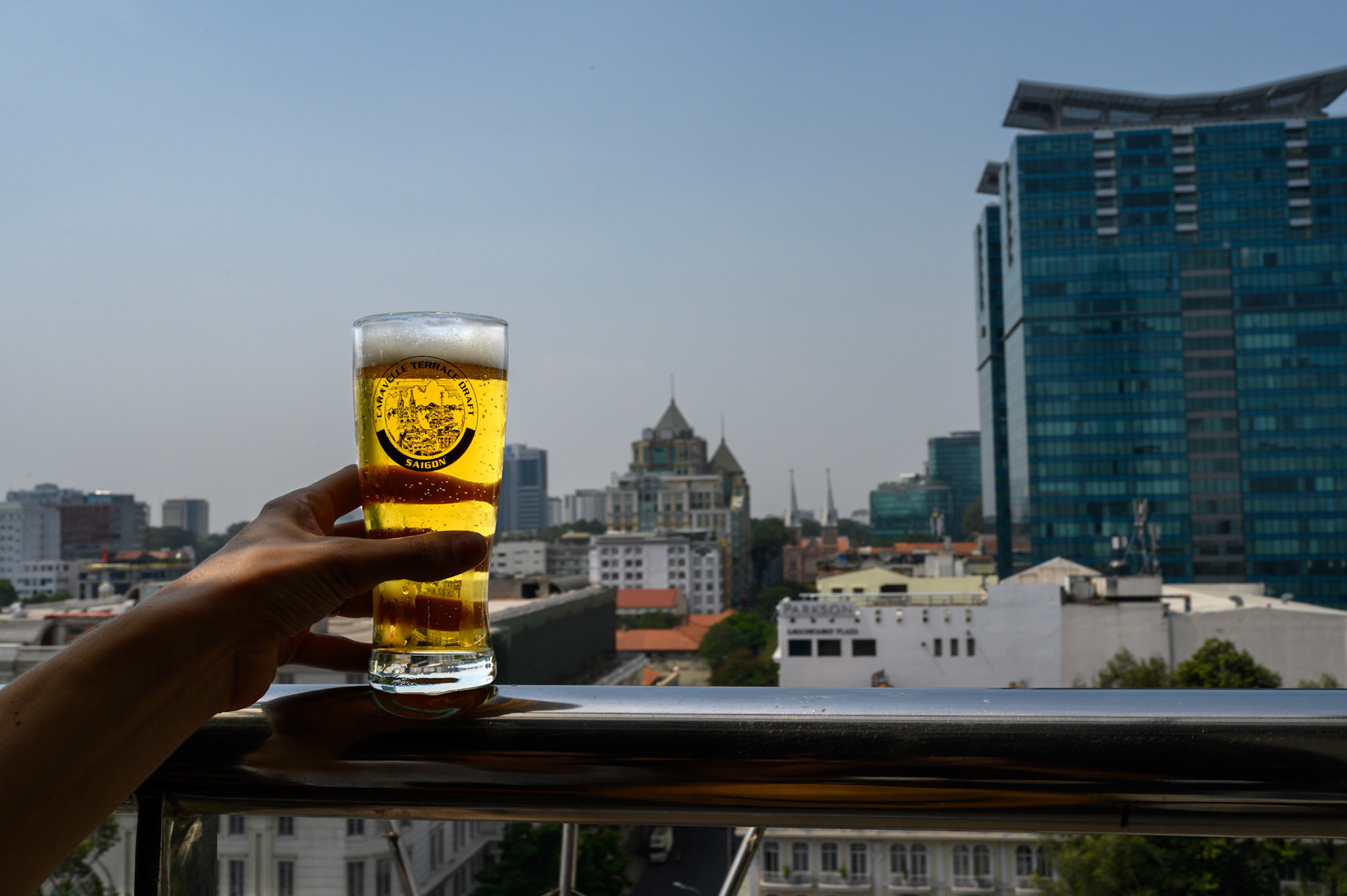 Sheryl drinks a beer at the Vietnam War era journalist's bar