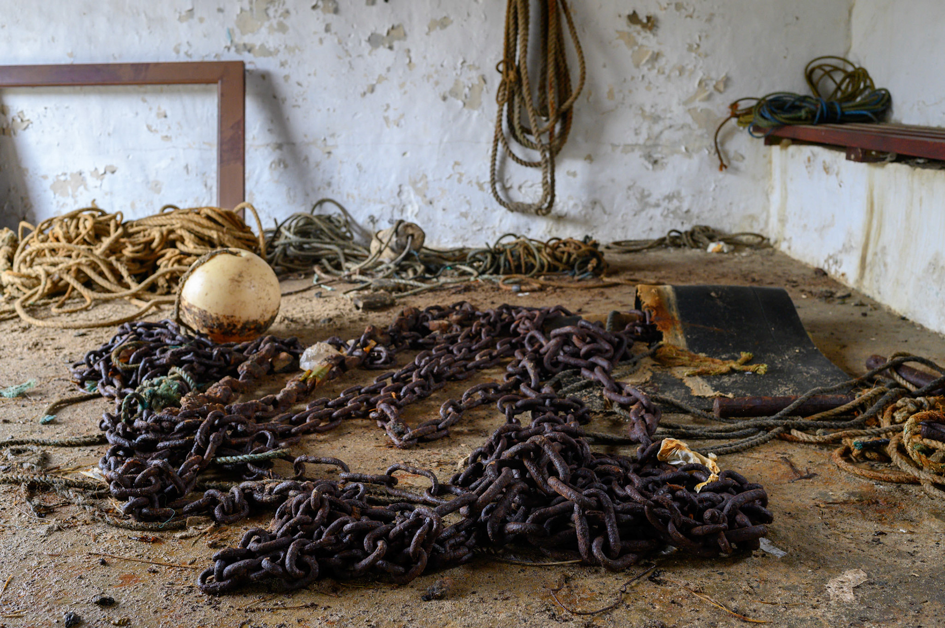 Rusted chain inside a gear shed at the Ness harbour.