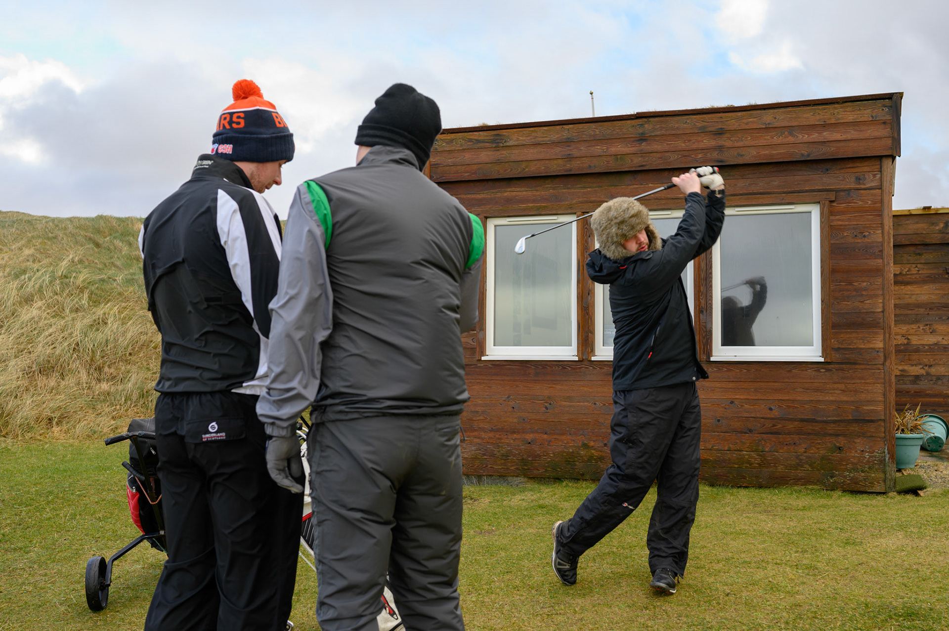 Every yeary on this day these Lewis and Harris lads play golf, whatever the weather. The Stornoway golf club was sensibly closed, but the Harris Golf Club has no such qualms about a bit of wild weather.
A practice swing to warm up before getting serious.