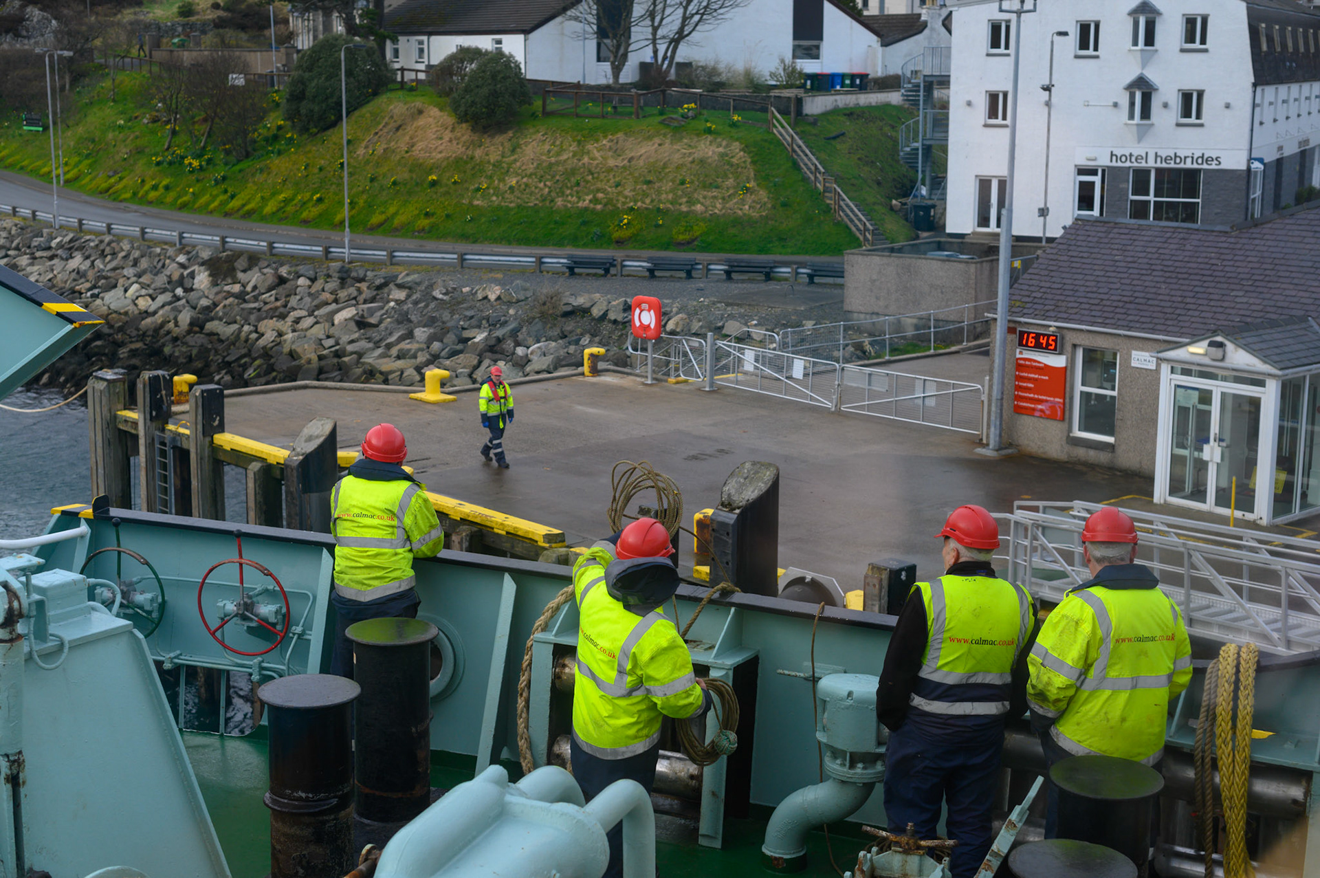 The ferry crew preparing to throw morring ropes at Tarbet.
