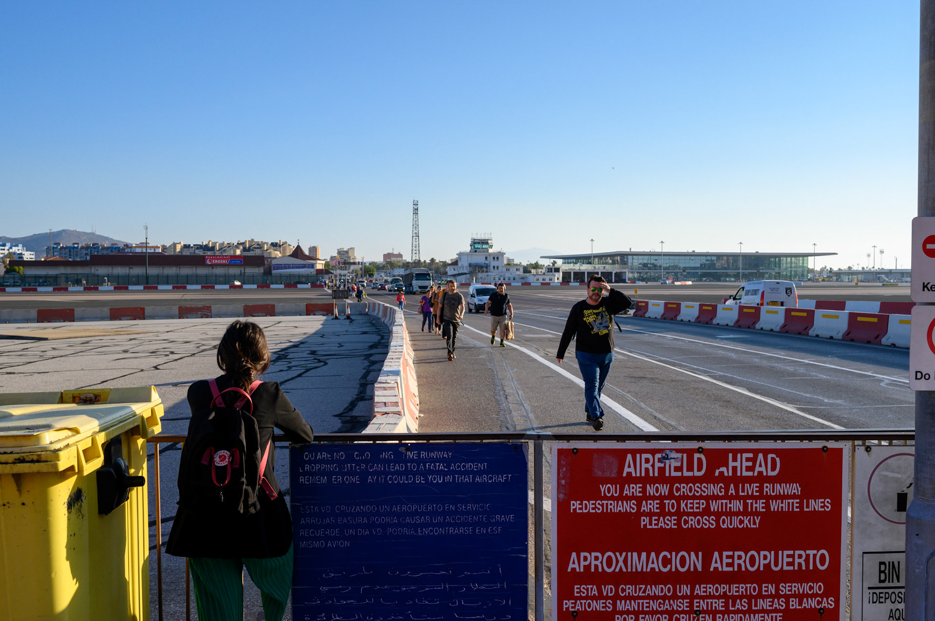 Walking across a runway. The road from la Linea to Gibraltar cross the main airport.