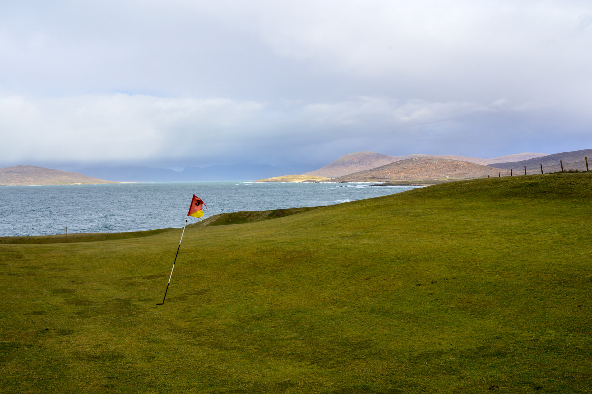 The Harris Golf Club. The weather alternated between chill sunshine and sleet. The whipping wind was a constant.