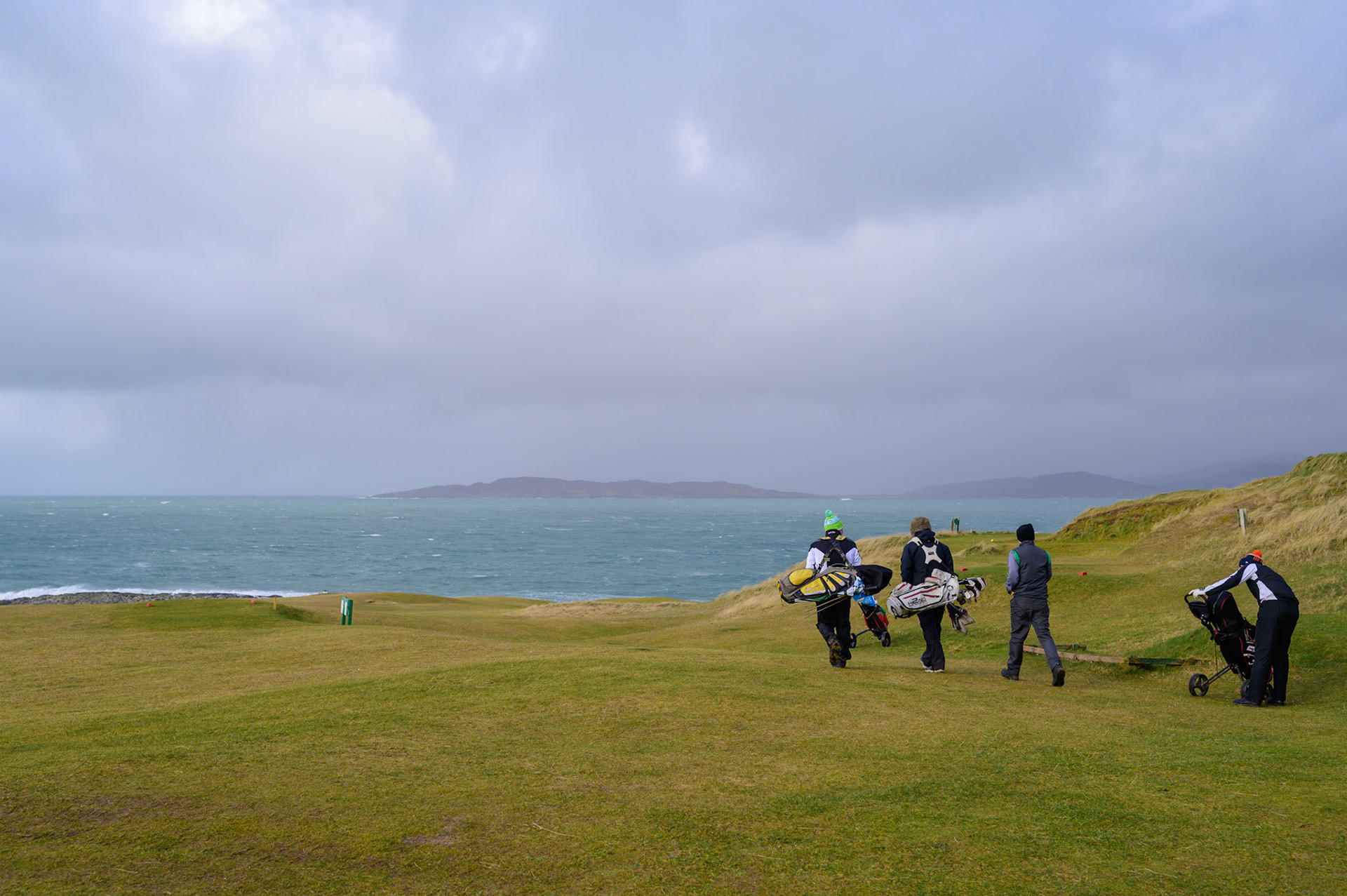 Every yeary on this day these Lewis and Harris lads play golf, whatever the weather. The Stornoway golf club was sensibly closed, but the Harris Golf Club has no such qualms about a bit of wild weather.
The first hole is underway and this photographer is heading for somewhere warm.