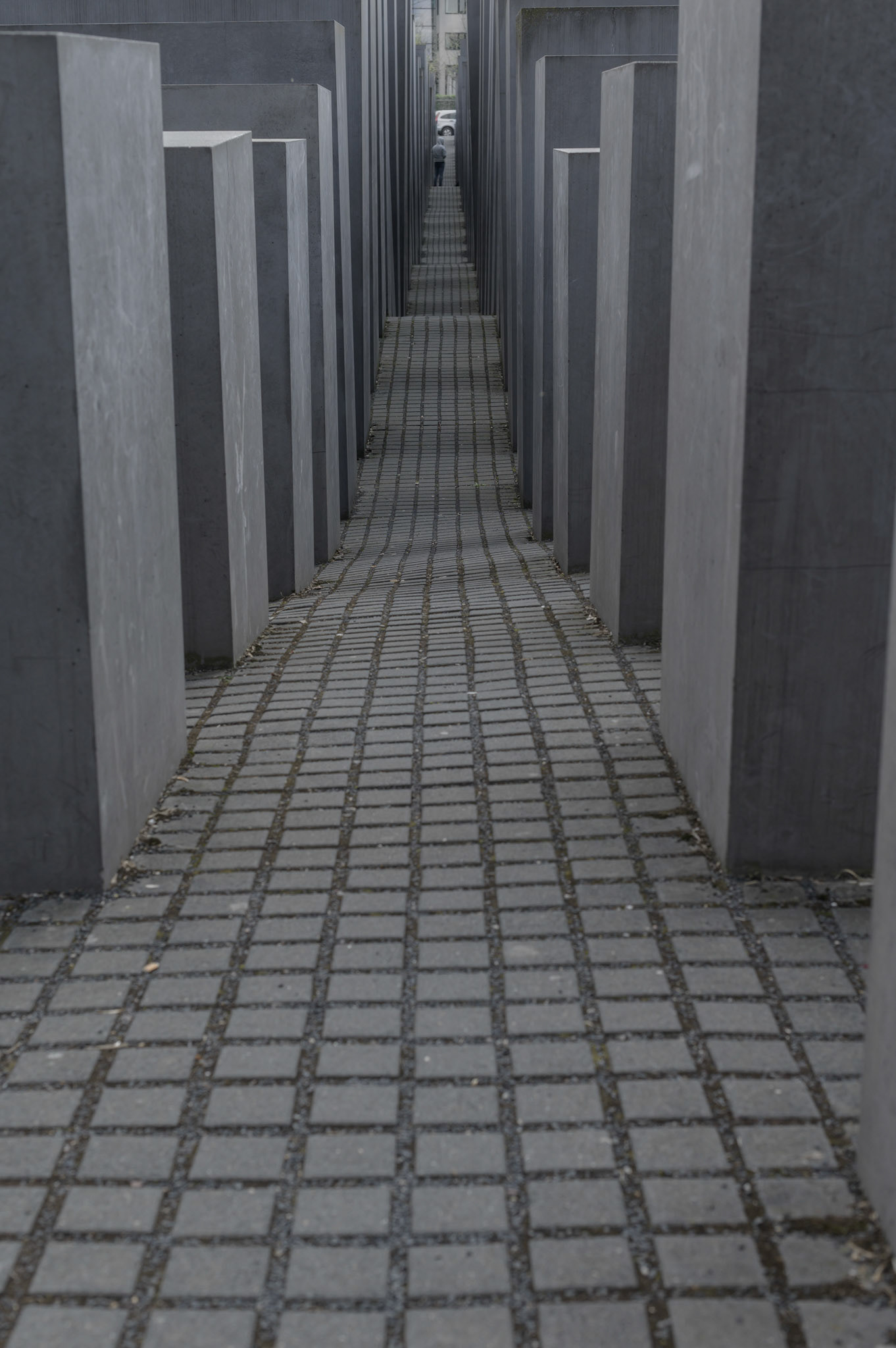 According to the designer, The Berlin Jewish Memorial  is not meant to signify anything. A person entering it is free to find their own meaning. For me, walking the canyons and looking over the expanse of grey blocks quickly brought a deeply contemplative slightly claustrophobic mood of insignificance into which the reason for the memorial could expand into consciouness.