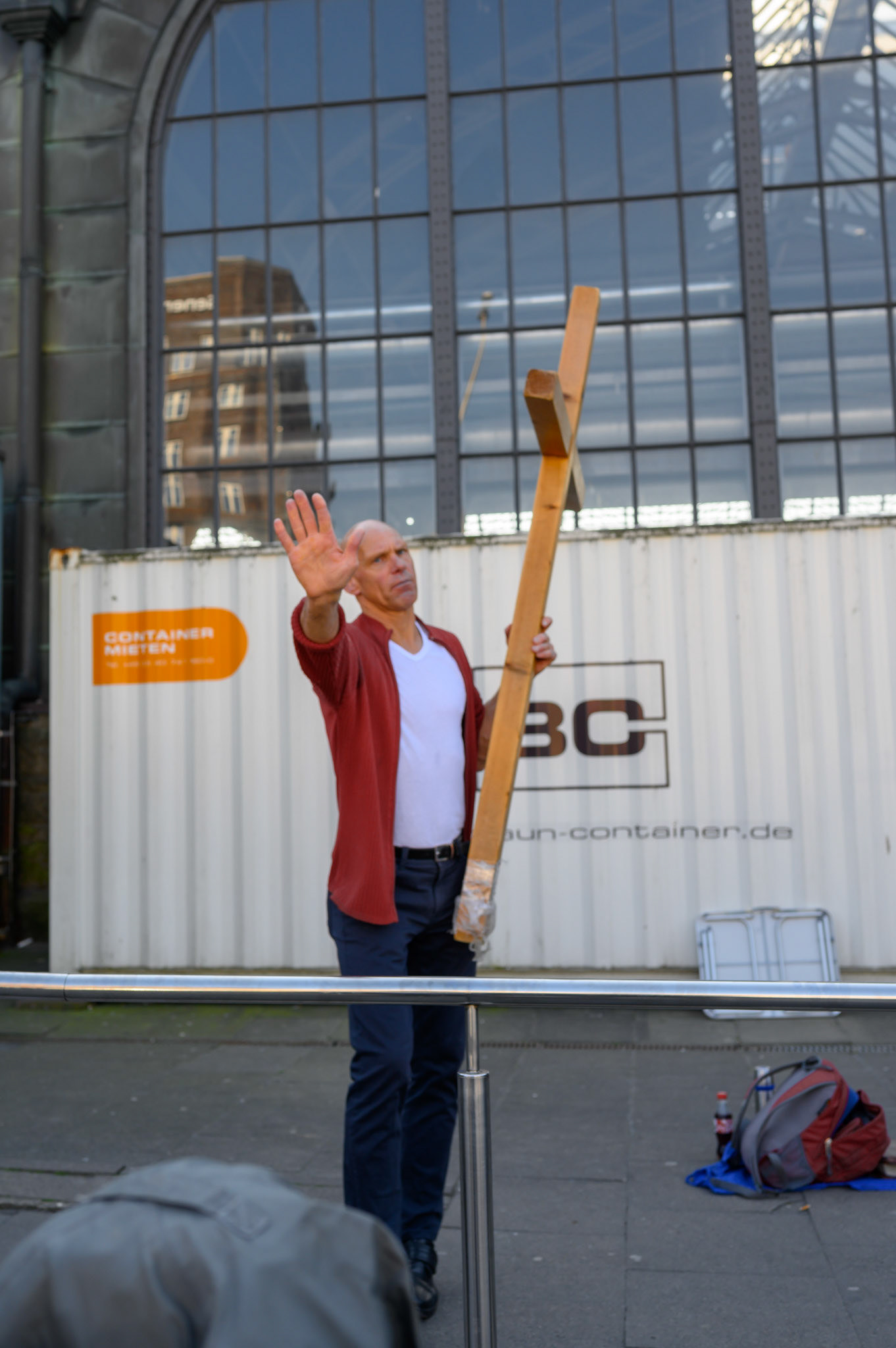 Aggressively preaching with a large cross outside a major train staion in Hamburg, this preacher was remarkably reluctant to have his photo taken