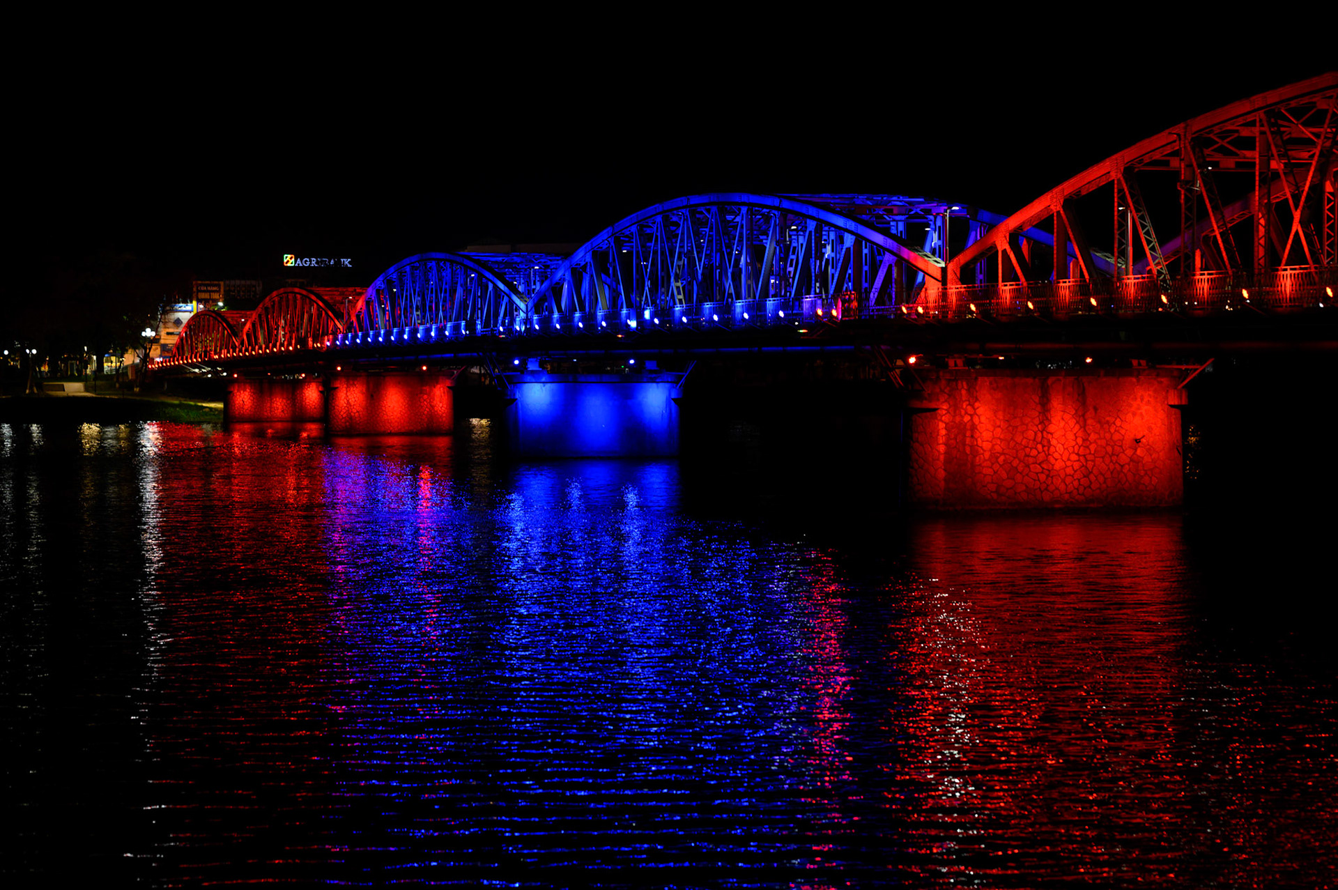 The Hue bridge lights the Perfume River at night.