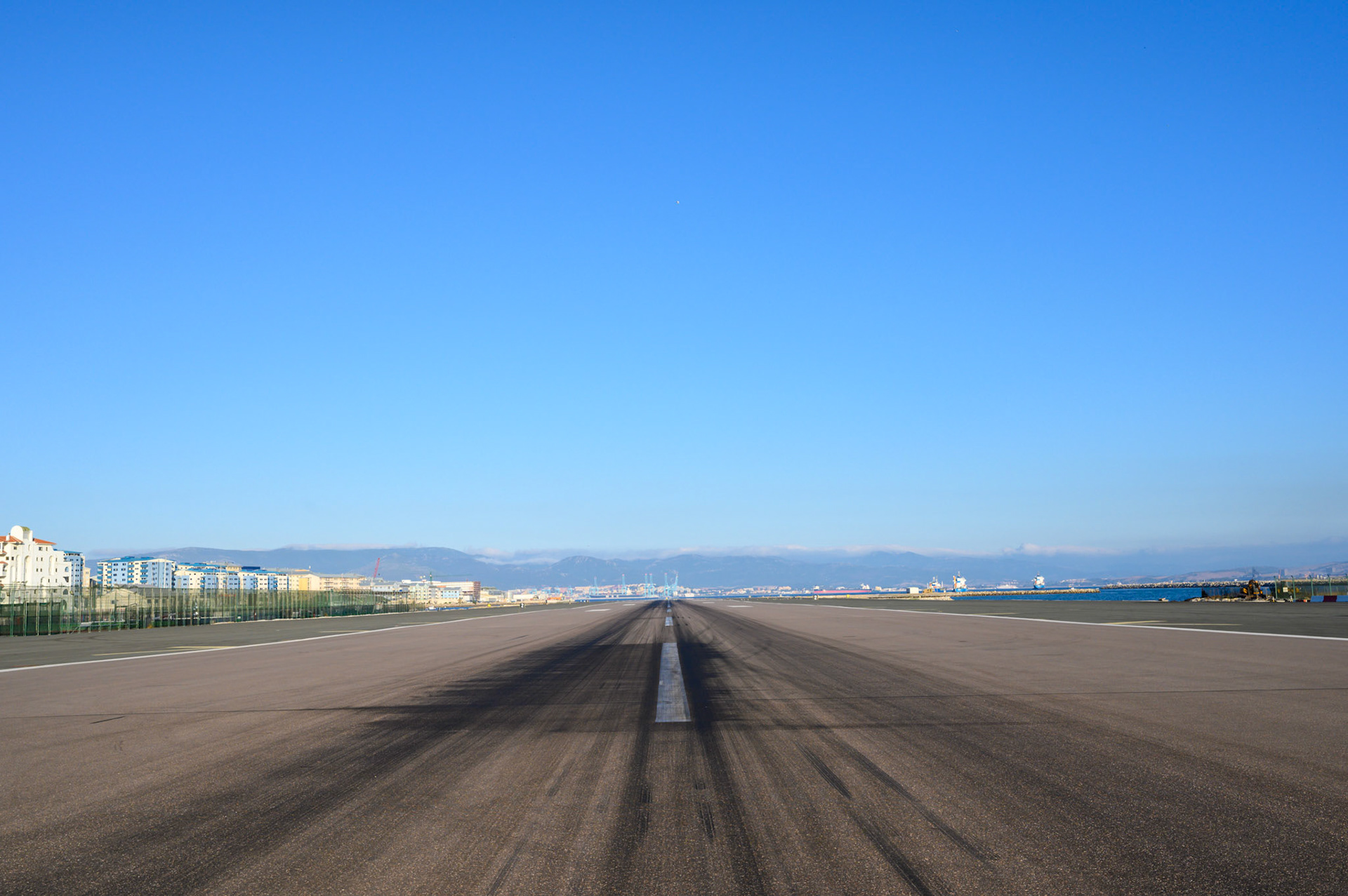 Walking across a runway. The road from la Linea to Gibraltar cross the main airport.