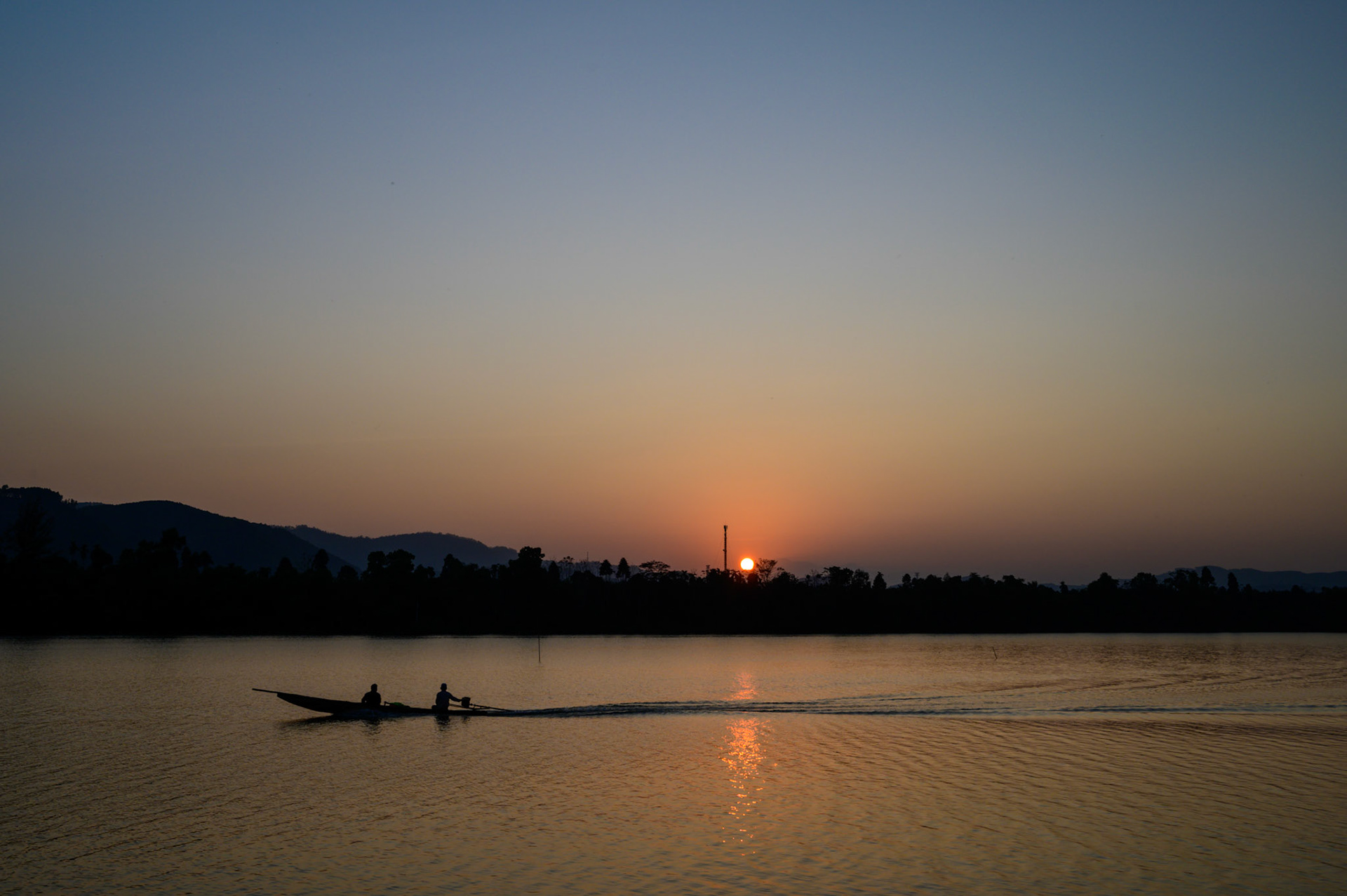 Watching the sunset over the Perfume River