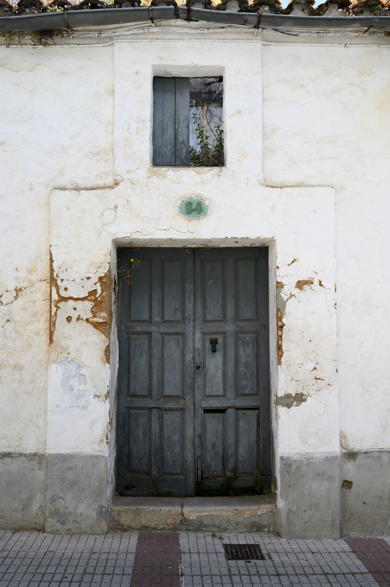 The door to a derelict house