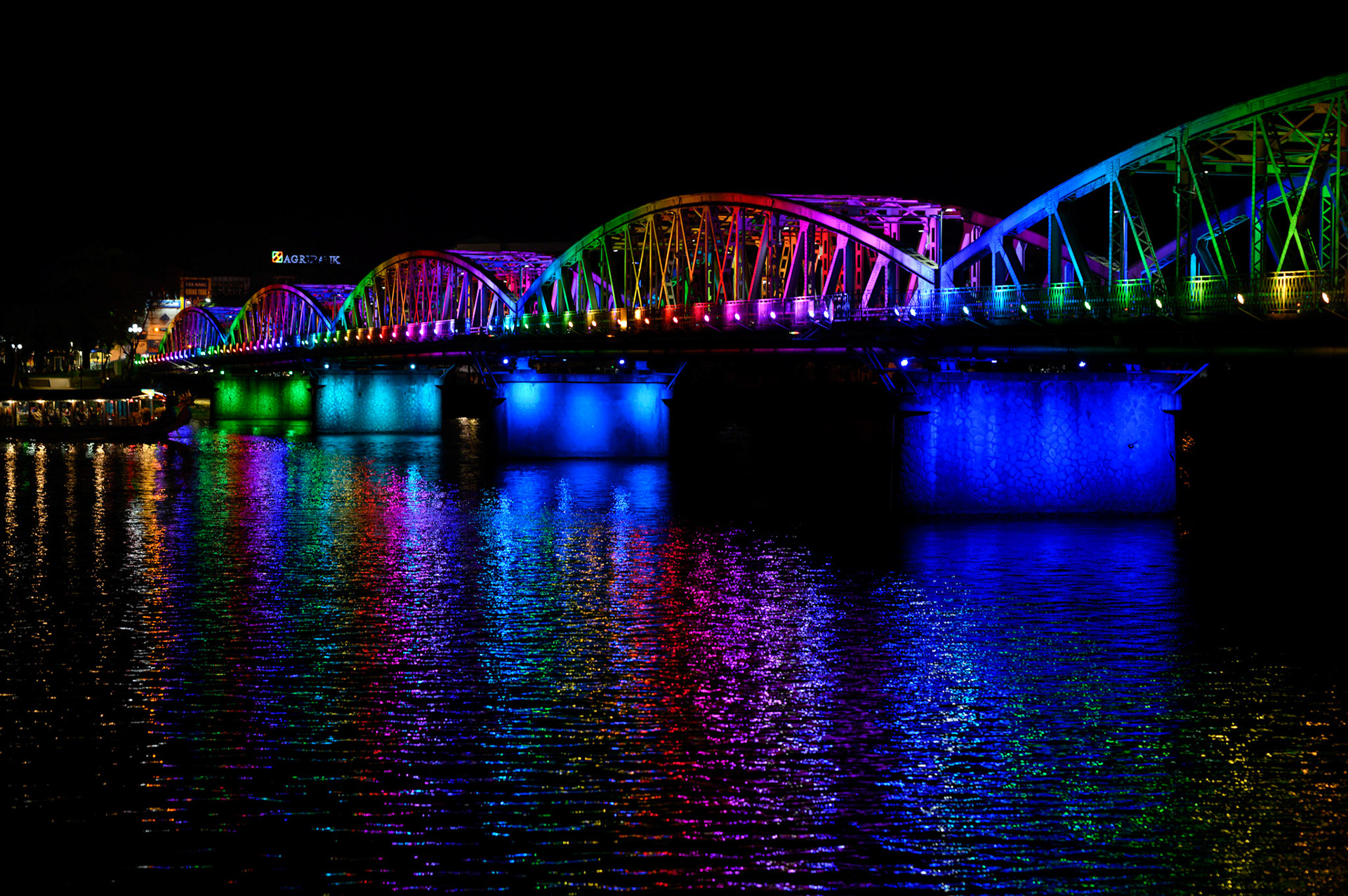 The Hue bridge lights the Perfume River at night.
