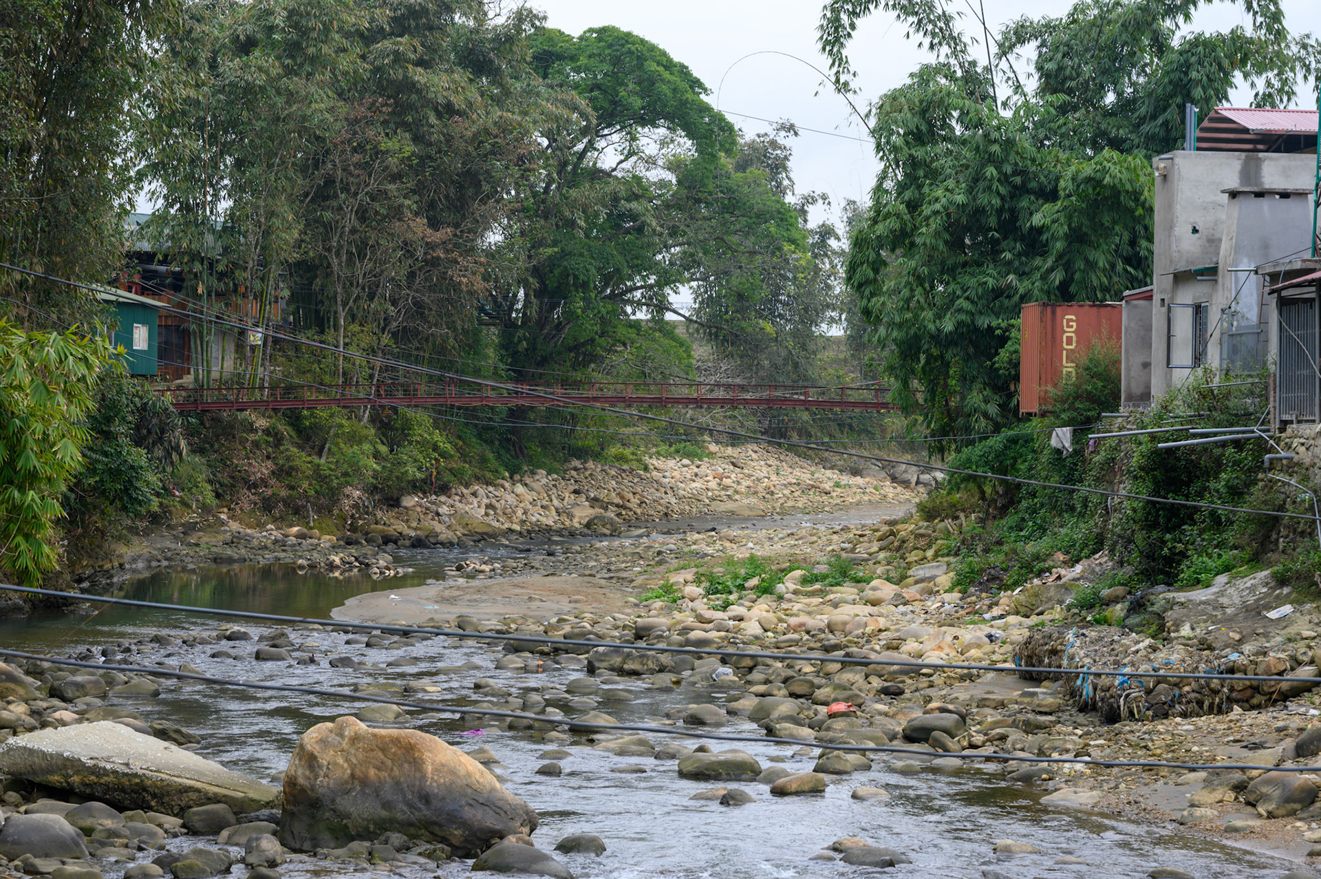 The foot and motorcycle bridge into Ta Van