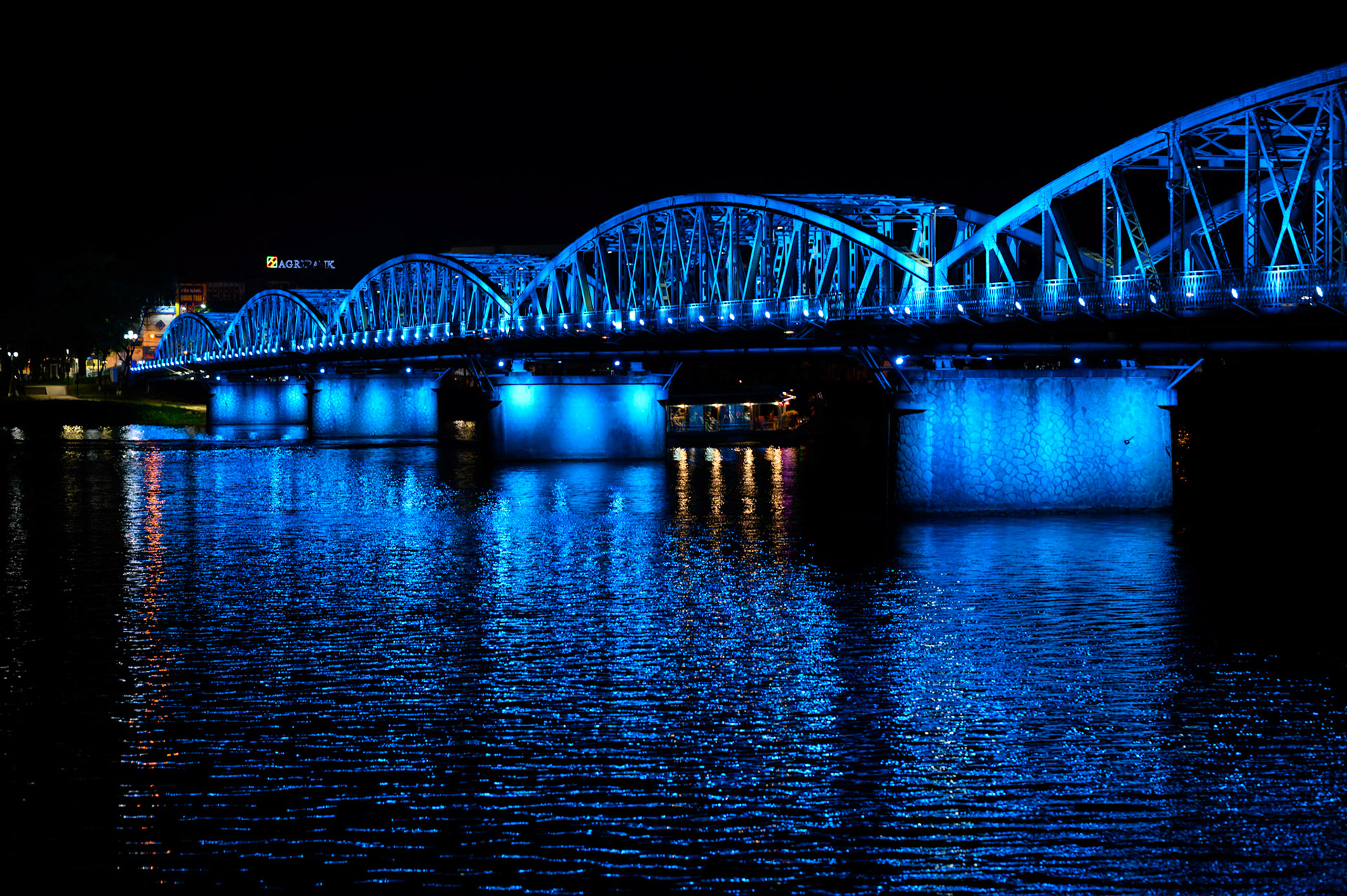 The Hue bridge lights the Perfume River at night.