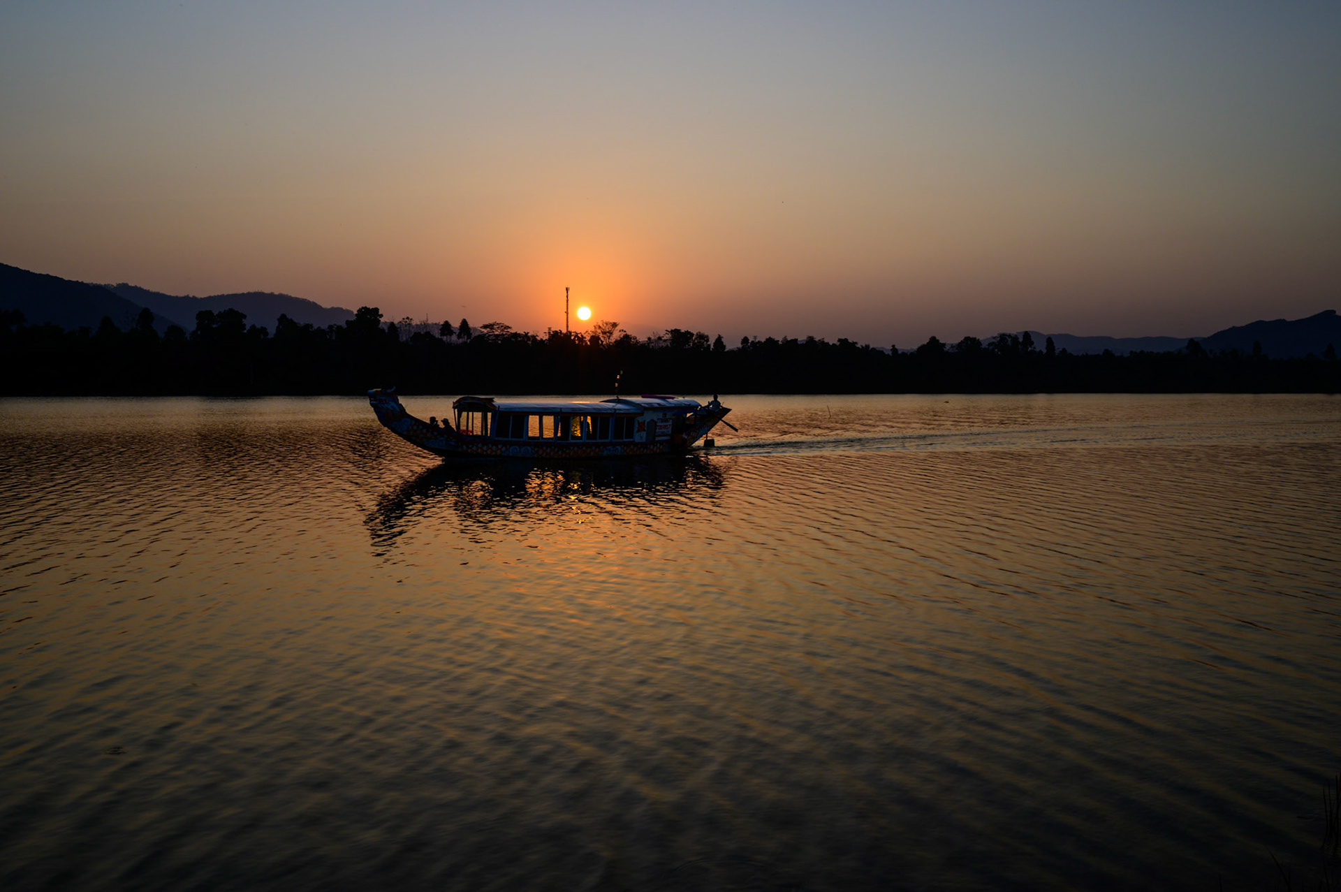 Watching the sunset over the Perfume River