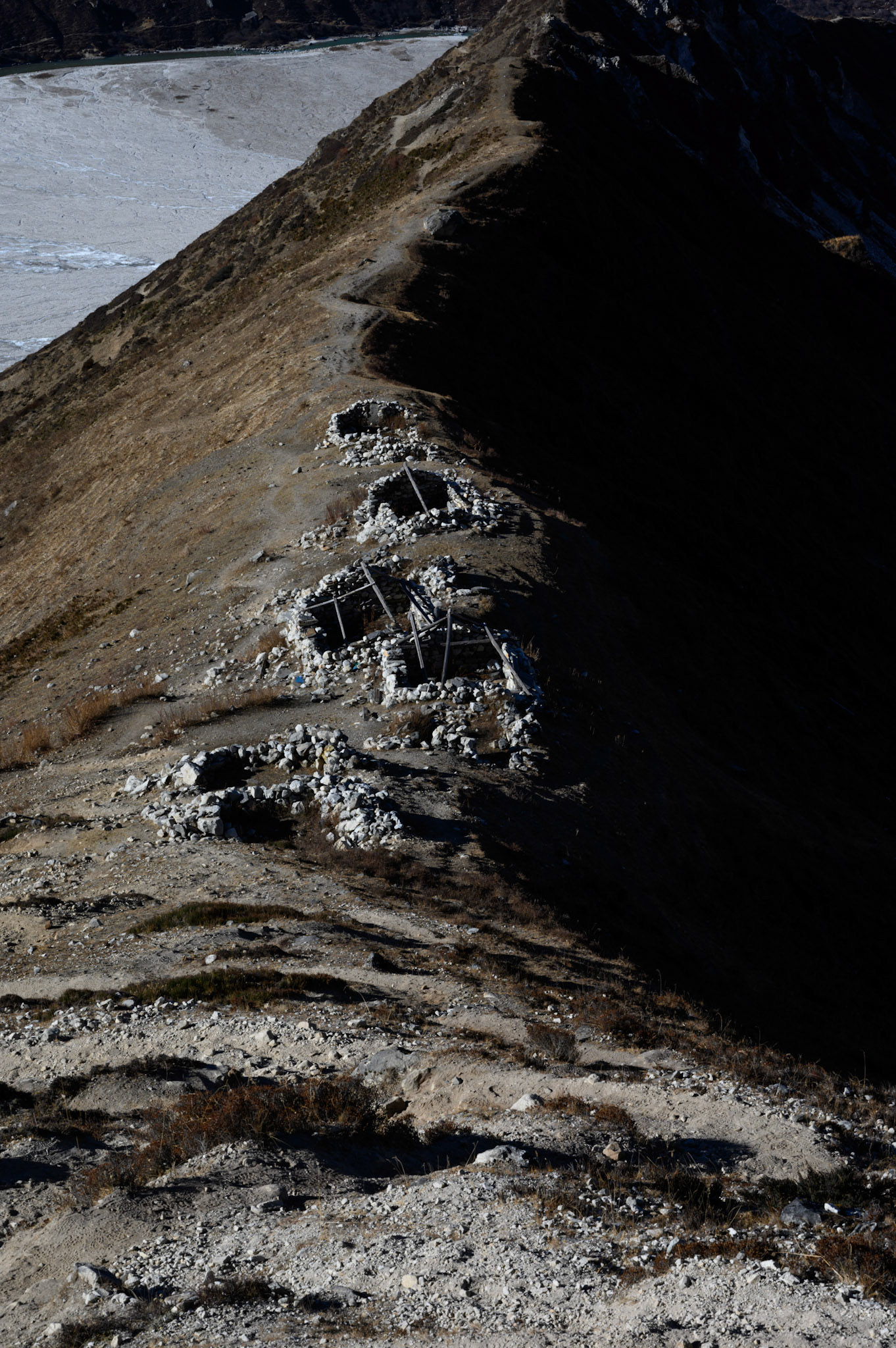 Abandoned yak herders huts on the lower slopes of Chergori
