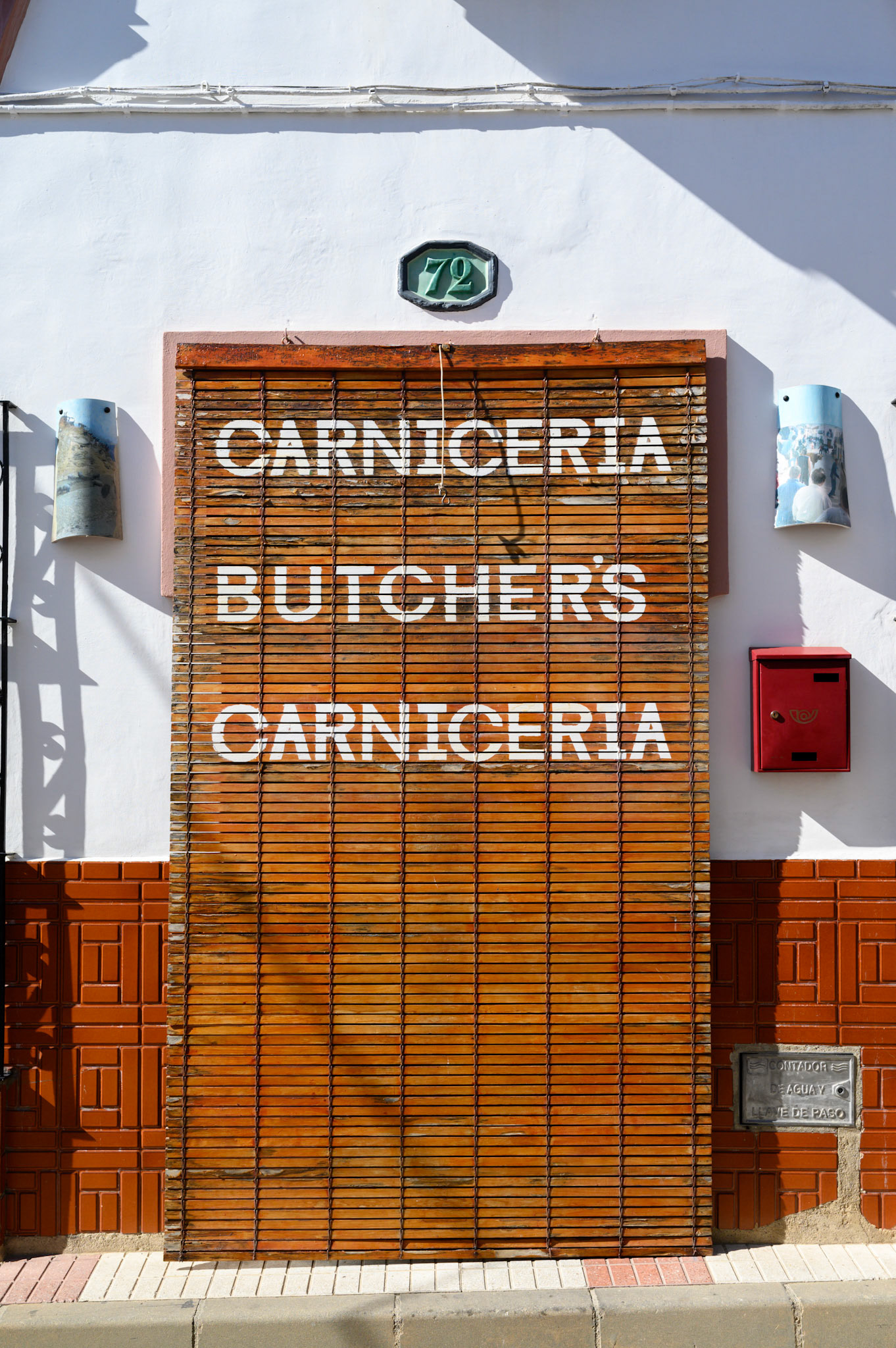 Helpfully translated into English. The blind was permanently down, but the shop was open behind it.