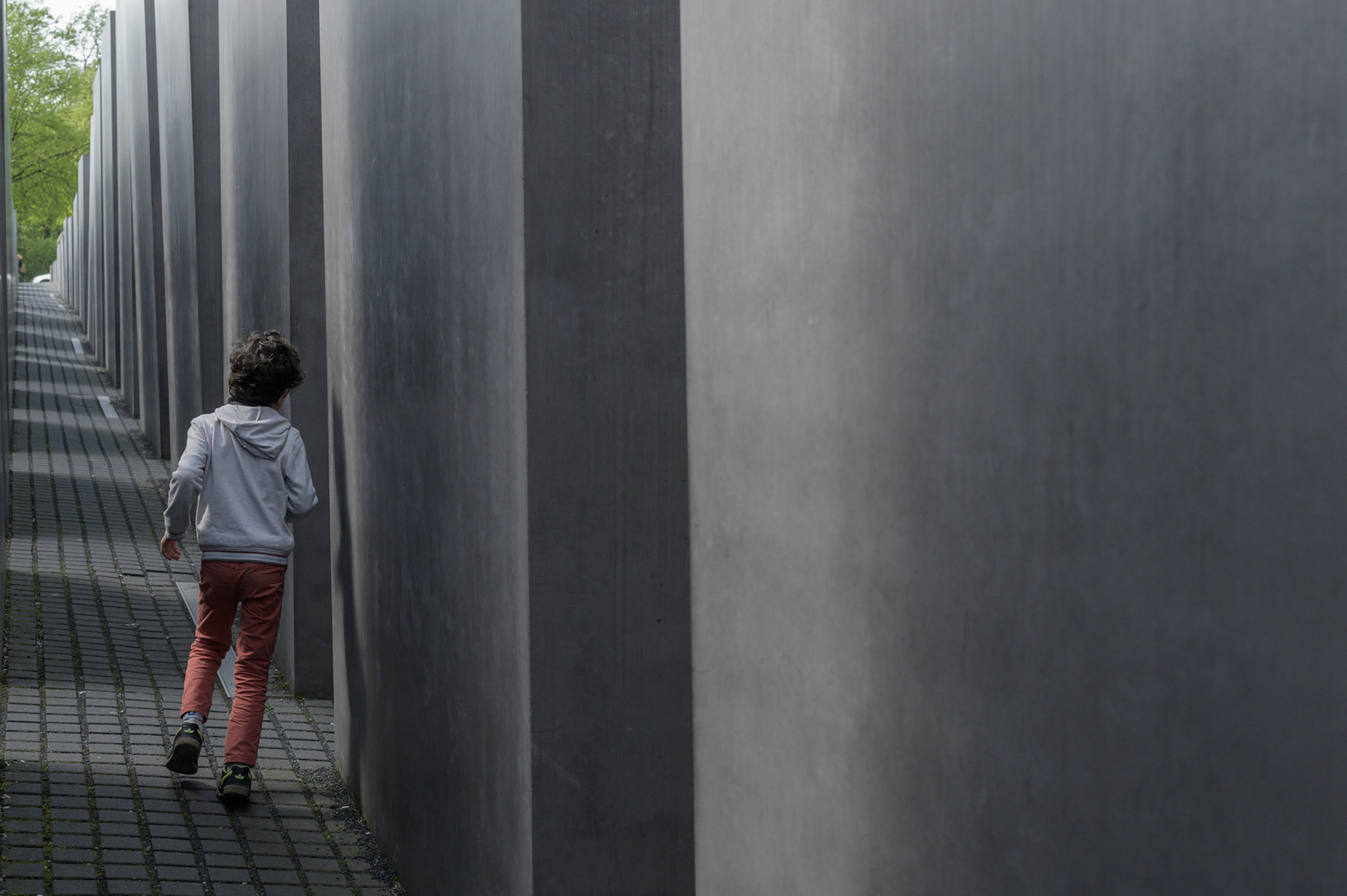 According to the designer, The Berlin Jewish Memorial  is not meant to signify anything. A person entering it is free to find their own meaning. For me, walking the canyons and looking over the expanse of grey blocks quickly brought a deeply contemplative slightly claustrophobic mood of insignificance into which the reason for the memorial could expand into consciouness.