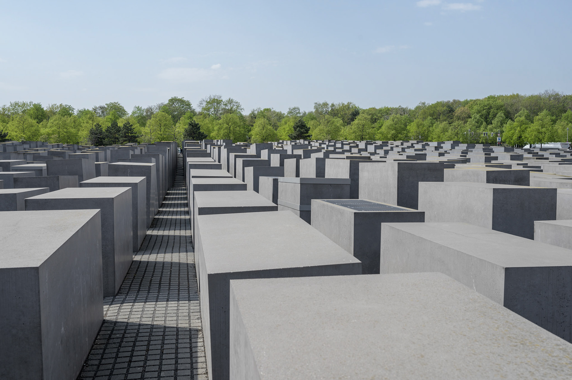 According to the designer, The Berlin Jewish Memorial  is not meant to signify anything. A person entering it is free to find their own meaning. For me, walking the canyons and looking over the expanse of grey blocks quickly brought a deeply contemplative slightly claustrophobic mood of insignificance into which the reason for the memorial could expand into consciouness.