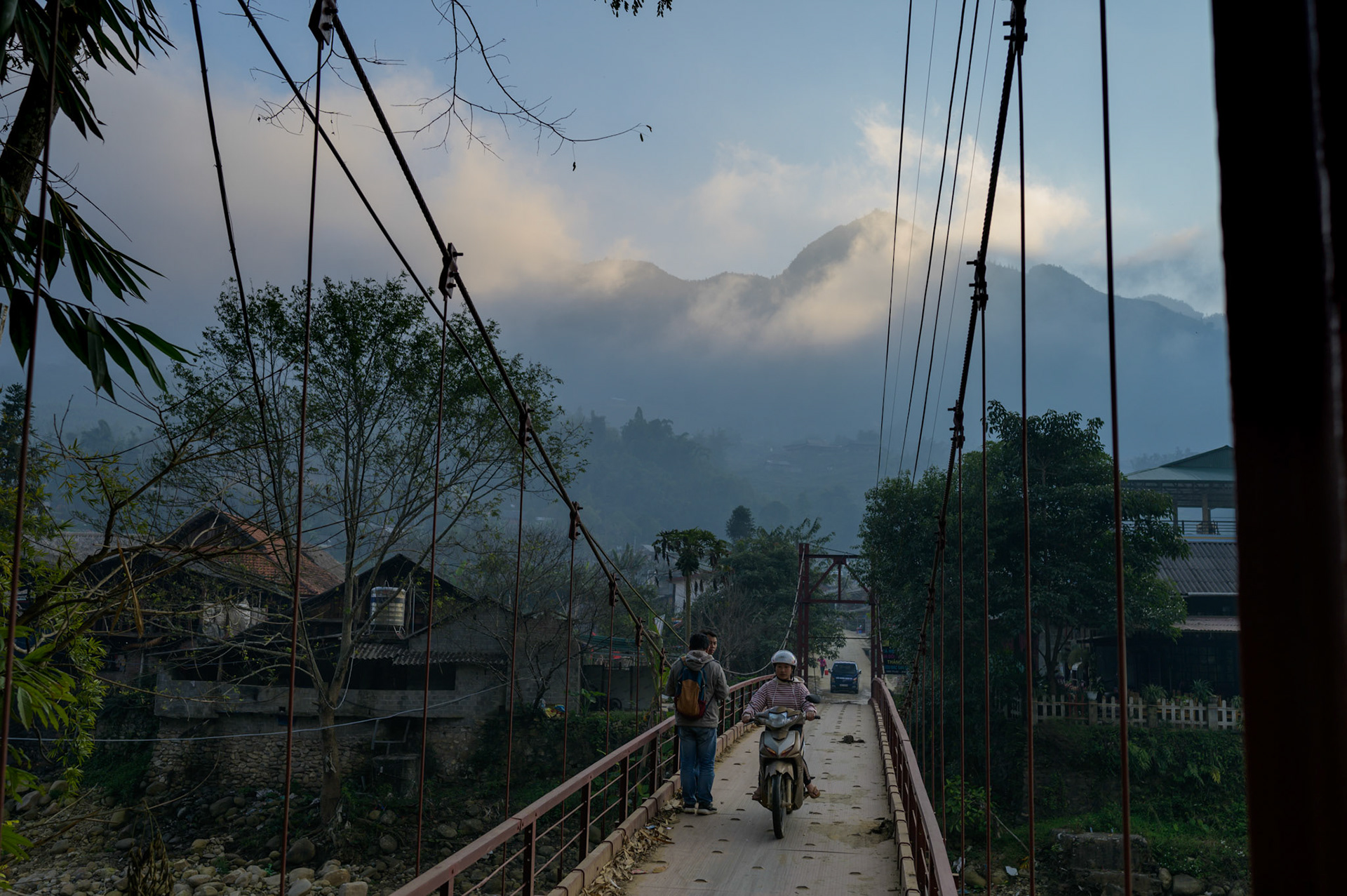 The foot and motorcycle bridge into Ta Van