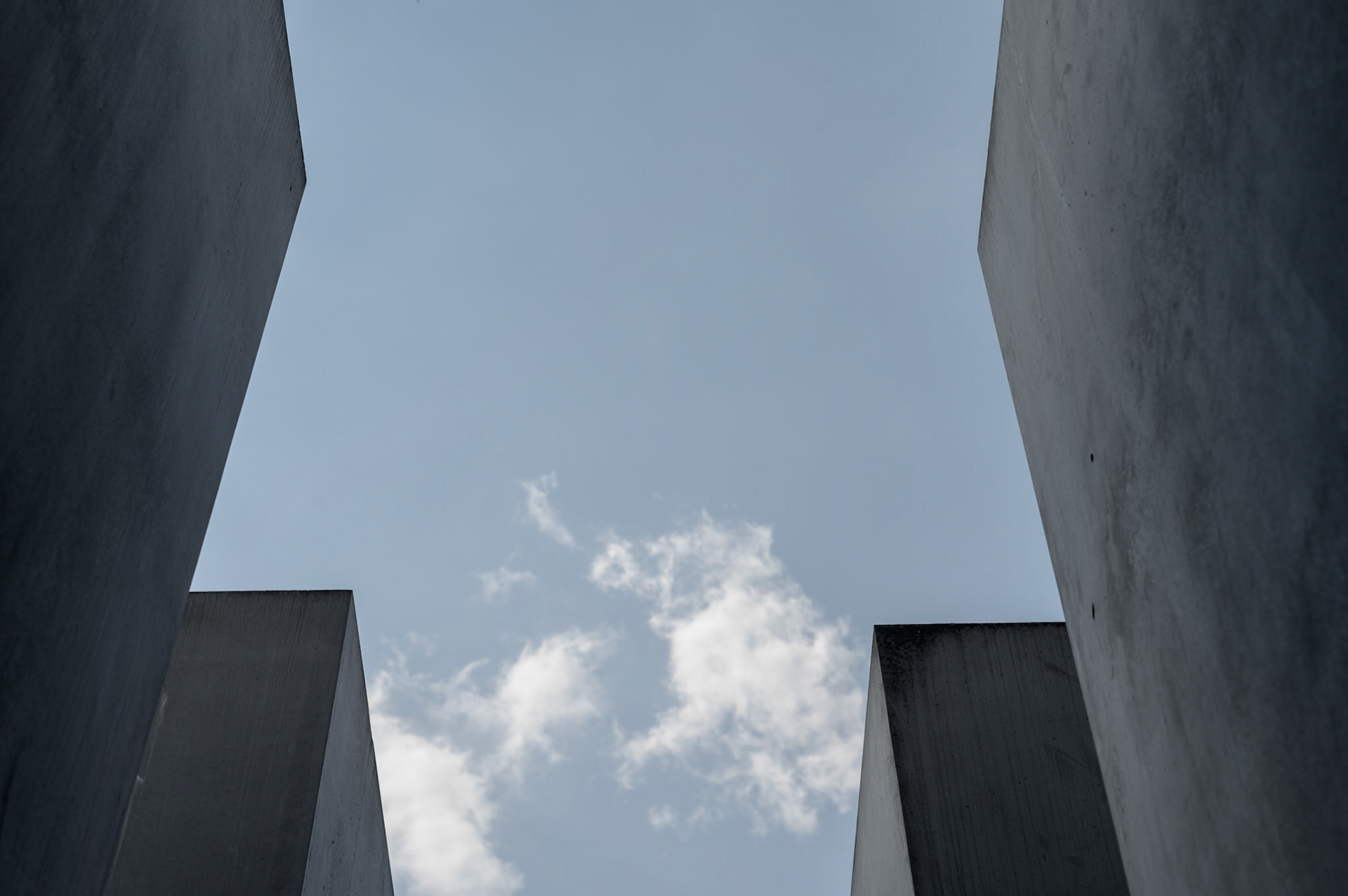According to the designer, The Berlin Jewish Memorial  is not meant to signify anything. A person entering it is free to find their own meaning. For me, walking the canyons and looking over the expanse of grey blocks quickly brought a deeply contemplative slightly claustrophobic mood of insignificance into which the reason for the memorial could expand into consciouness.