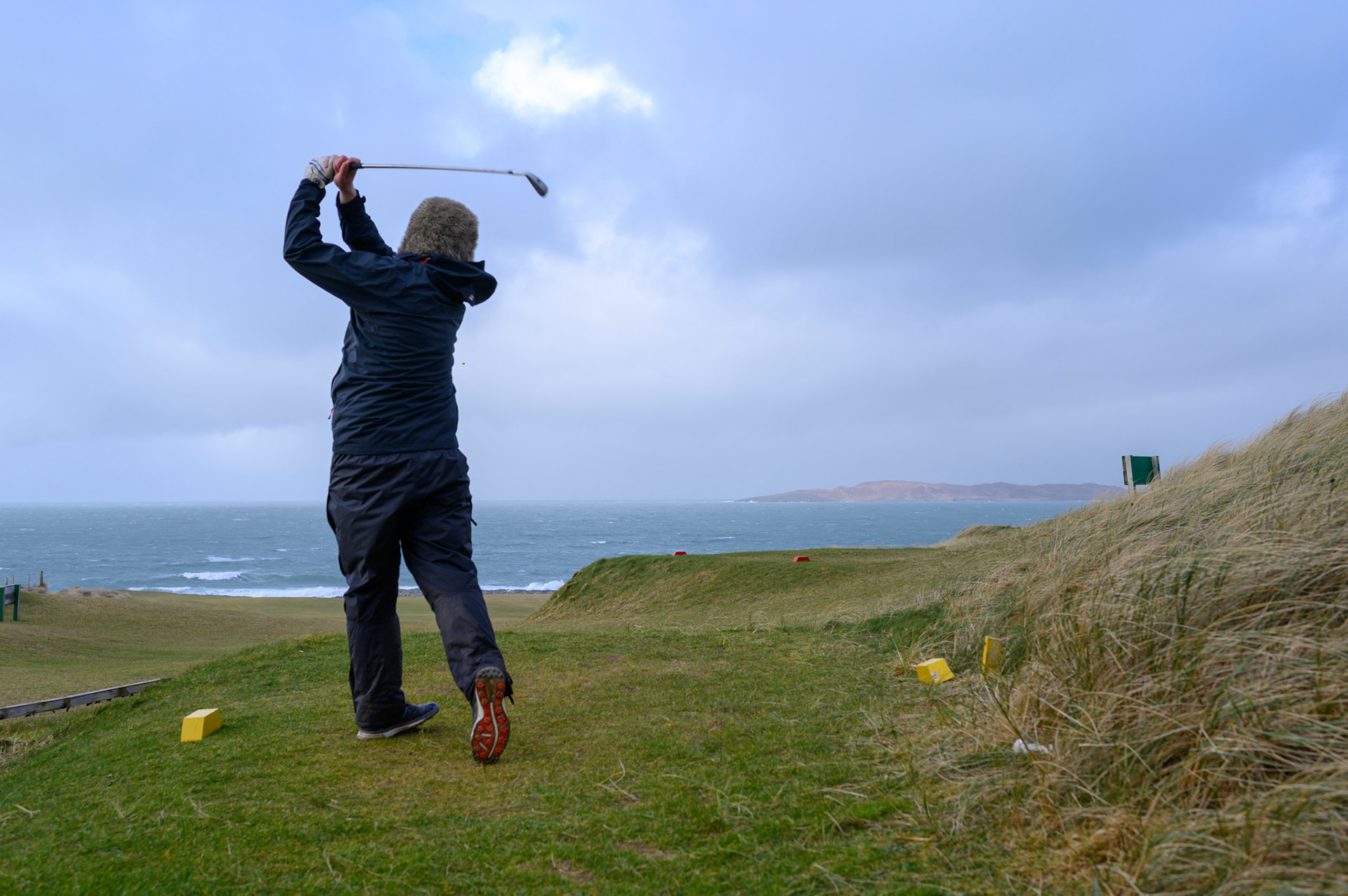 Every yeary on this day these Lewis and Harris lads play golf, whatever the weather. The Stornoway golf club was sensibly closed, but the Harris Golf Club has no such qualms about a bit of wild weather.
I was concerned standing behind that the ball would be blown straight back into me, but it amazingly landed on the green.