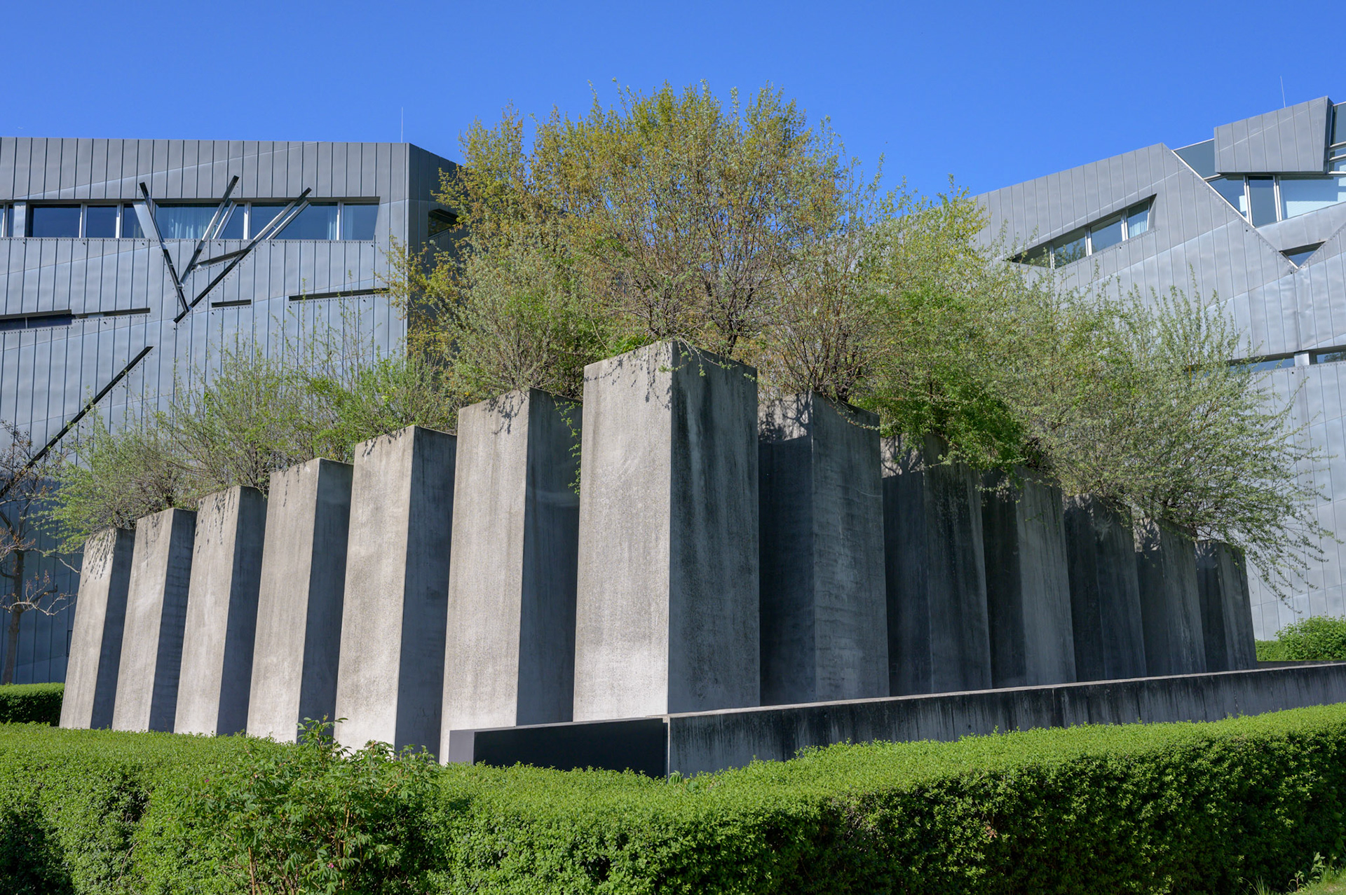 According to the designer, The Berlin Jewish Memorial  is not meant to signify anything. A person entering it is free to find their own meaning. For me, walking the canyons and looking over the expanse of grey blocks quickly brought a deeply contemplative slightly claustrophobic mood of insignificance into which the reason for the memorial could expand into consciouness.