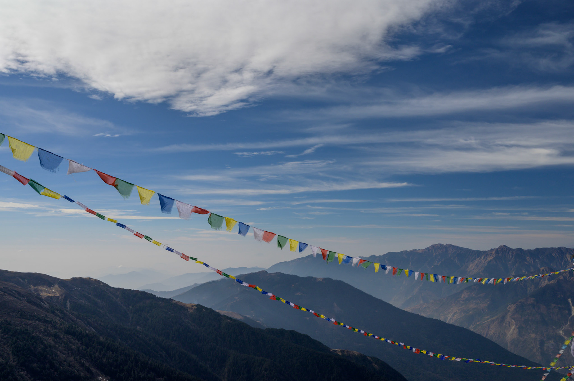 Prayer flags strung across a pass on the trail to Gosaikunda
