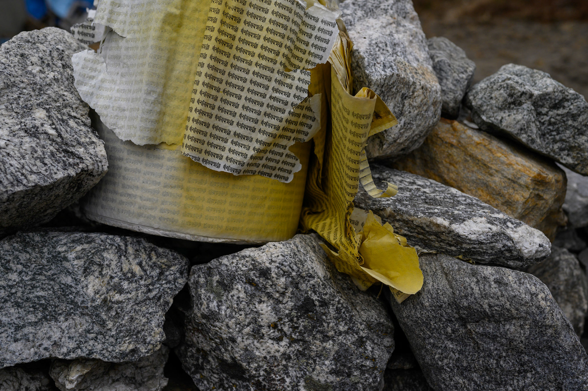 The prayer scroll from inside a prayer wheel. This was lodged on a wall with other parts that looked to have been smashed in the earthquake.