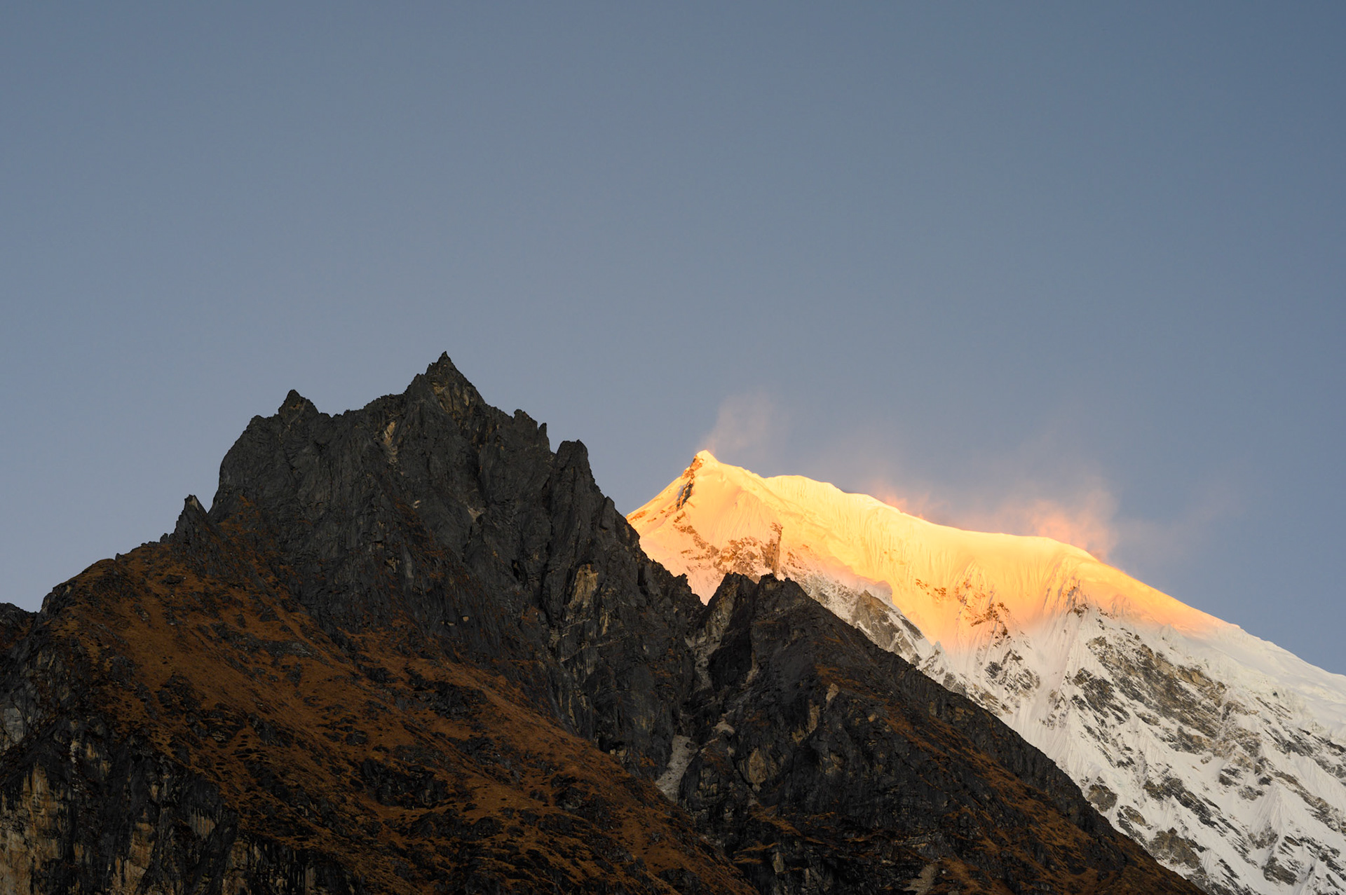 Sunrise from Kyanjin village, before climbing Chegori..