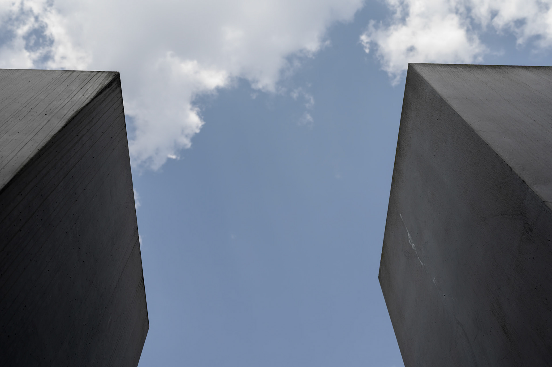 According to the designer, The Berlin Jewish Memorial  is not meant to signify anything. A person entering it is free to find their own meaning. For me, walking the canyons and looking over the expanse of grey blocks quickly brought a deeply contemplative slightly claustrophobic mood of insignificance into which the reason for the memorial could expand into consciouness.