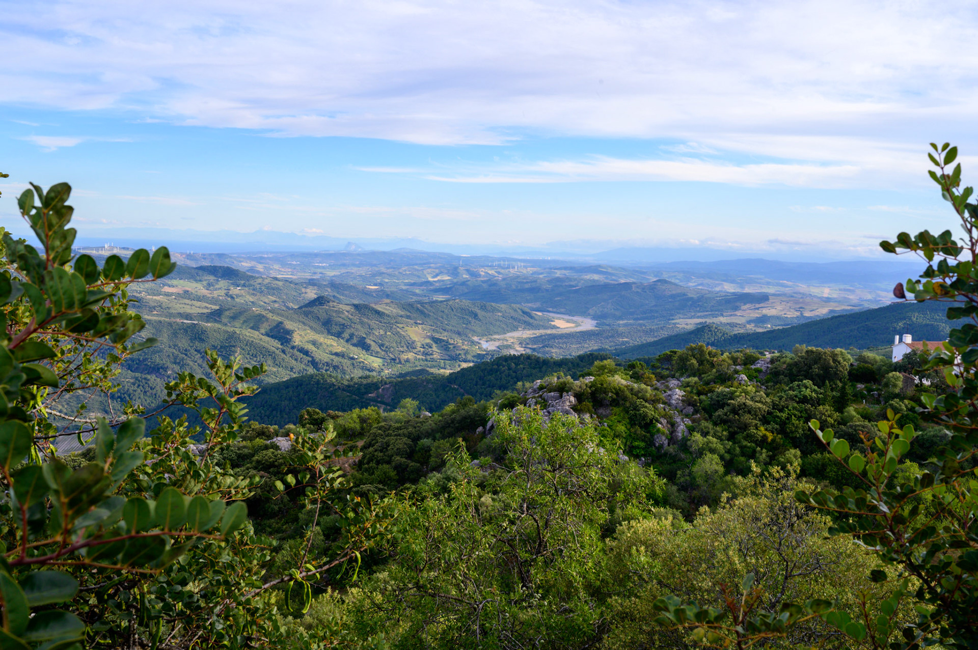 Gibraltar is a tiny bumb on the hazy horizon.