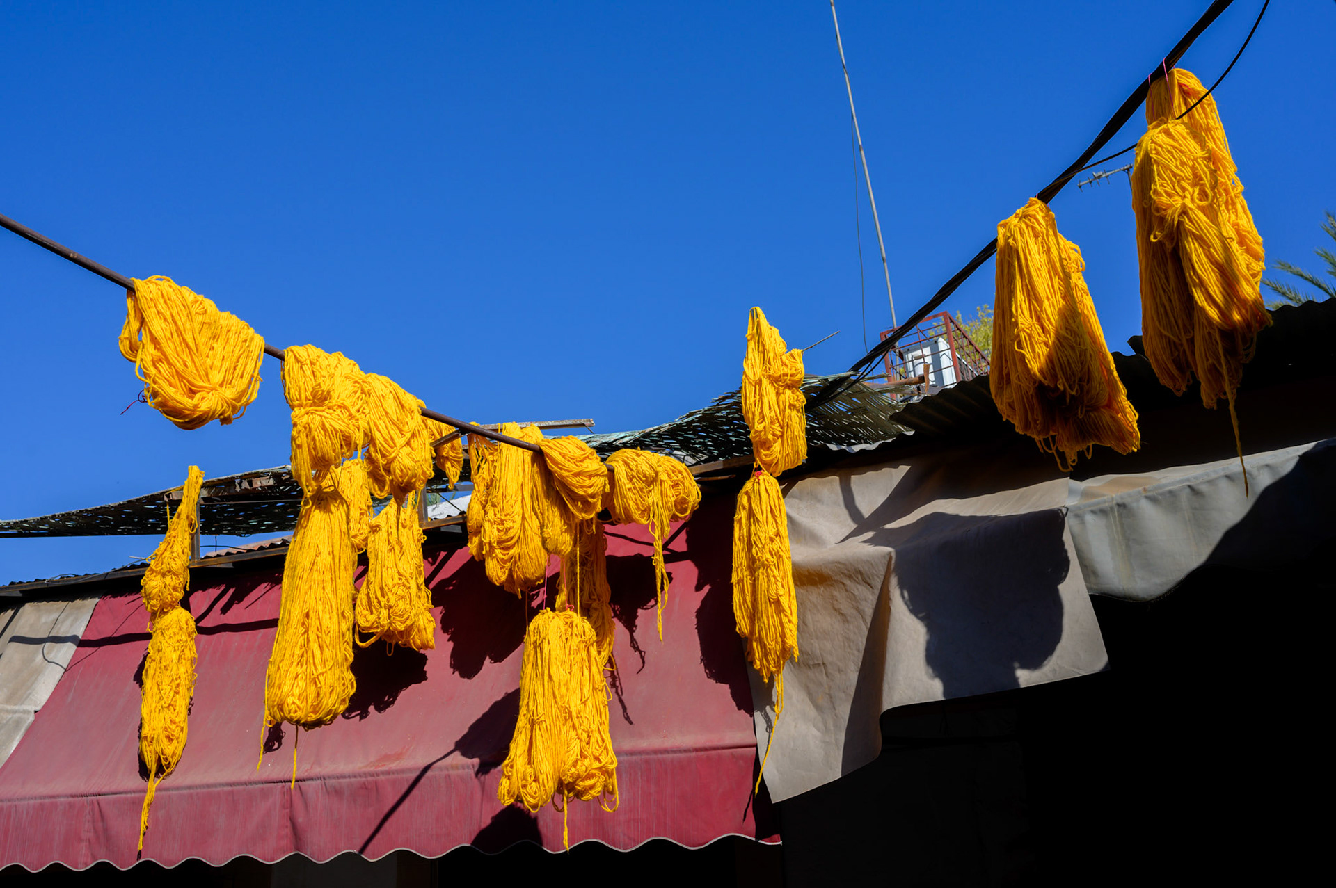 Dyed yarn drying in the morning sun