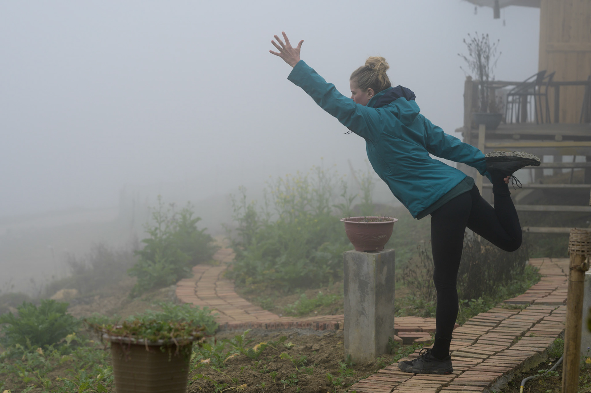 Sheryl practising asana in the mists