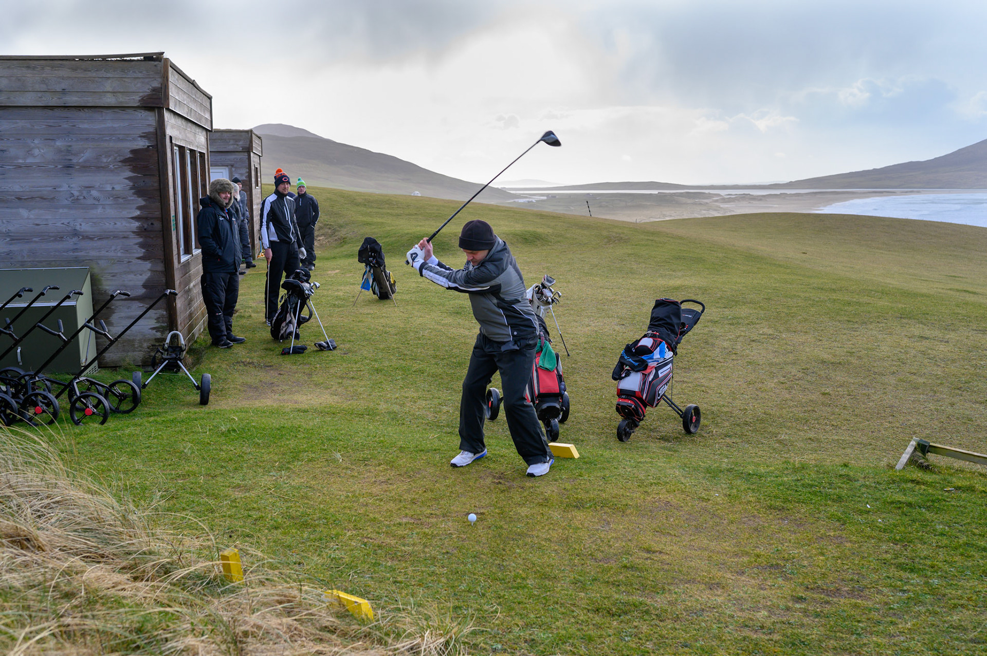 Every yeary on this day these Lewis and Harris lads play golf, whatever the weather. The Stornoway golf club was sensibly closed, but the Harris Golf Club has no such qualms about a bit of wild weather.
Teeing off.