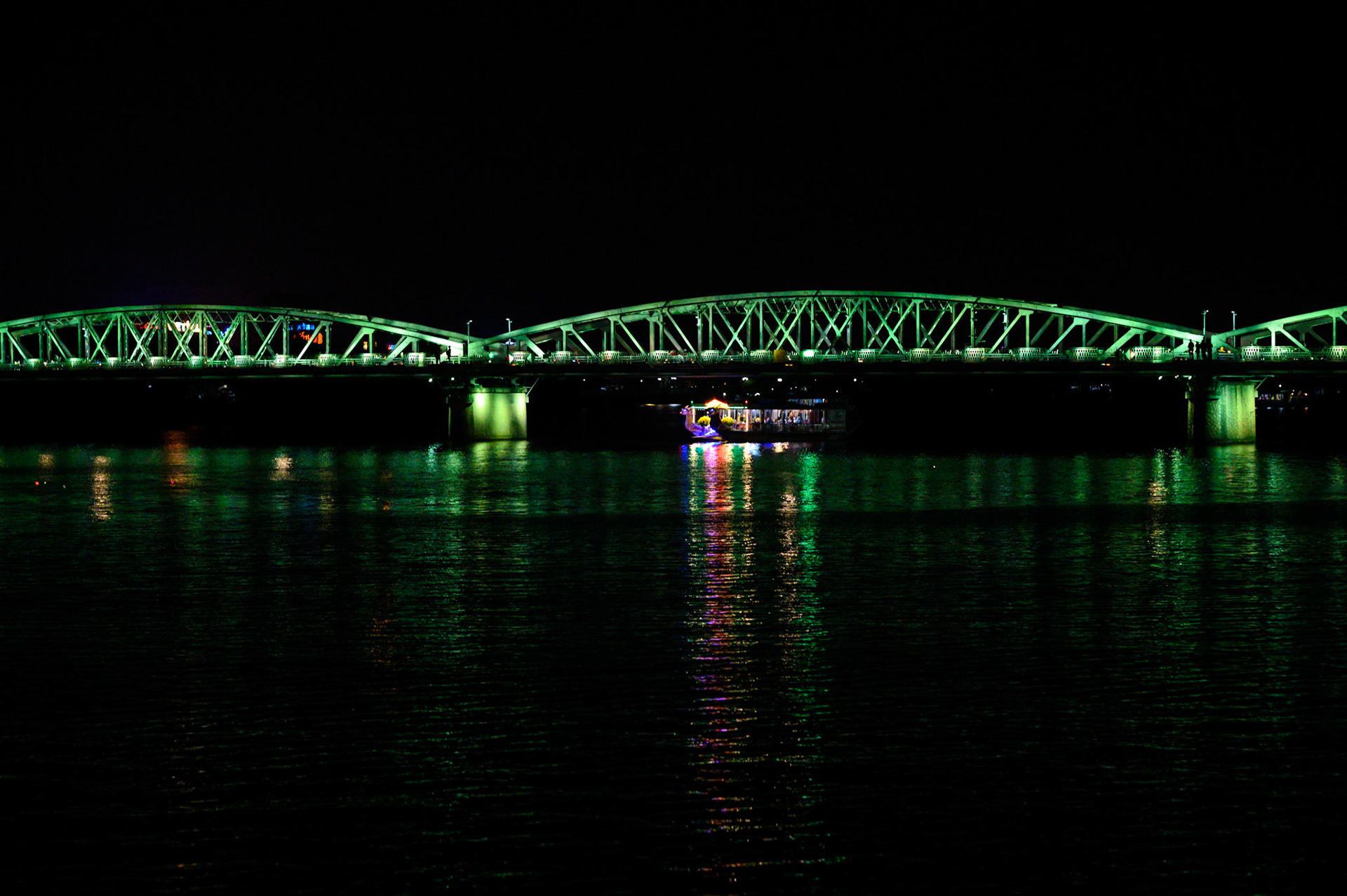 The Hue bridge lights the Perfume River at night.