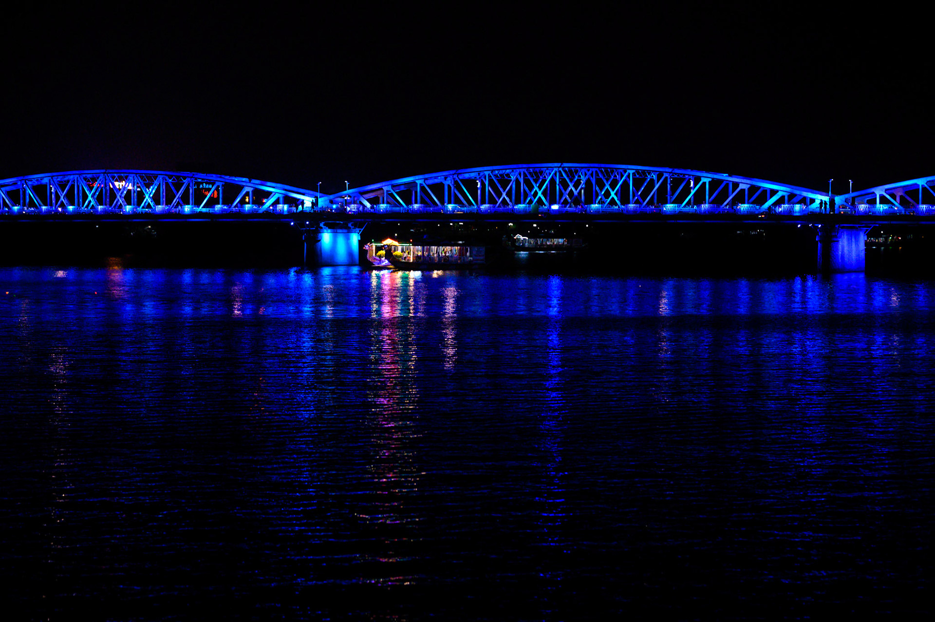 The Hue bridge lights the Perfume River at night.