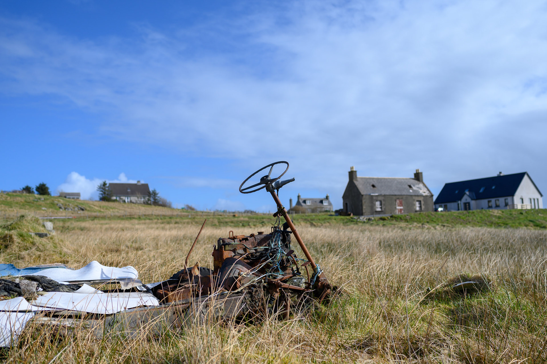 An old truck that is now past derelict sits on the heather bog in Upper Bayble