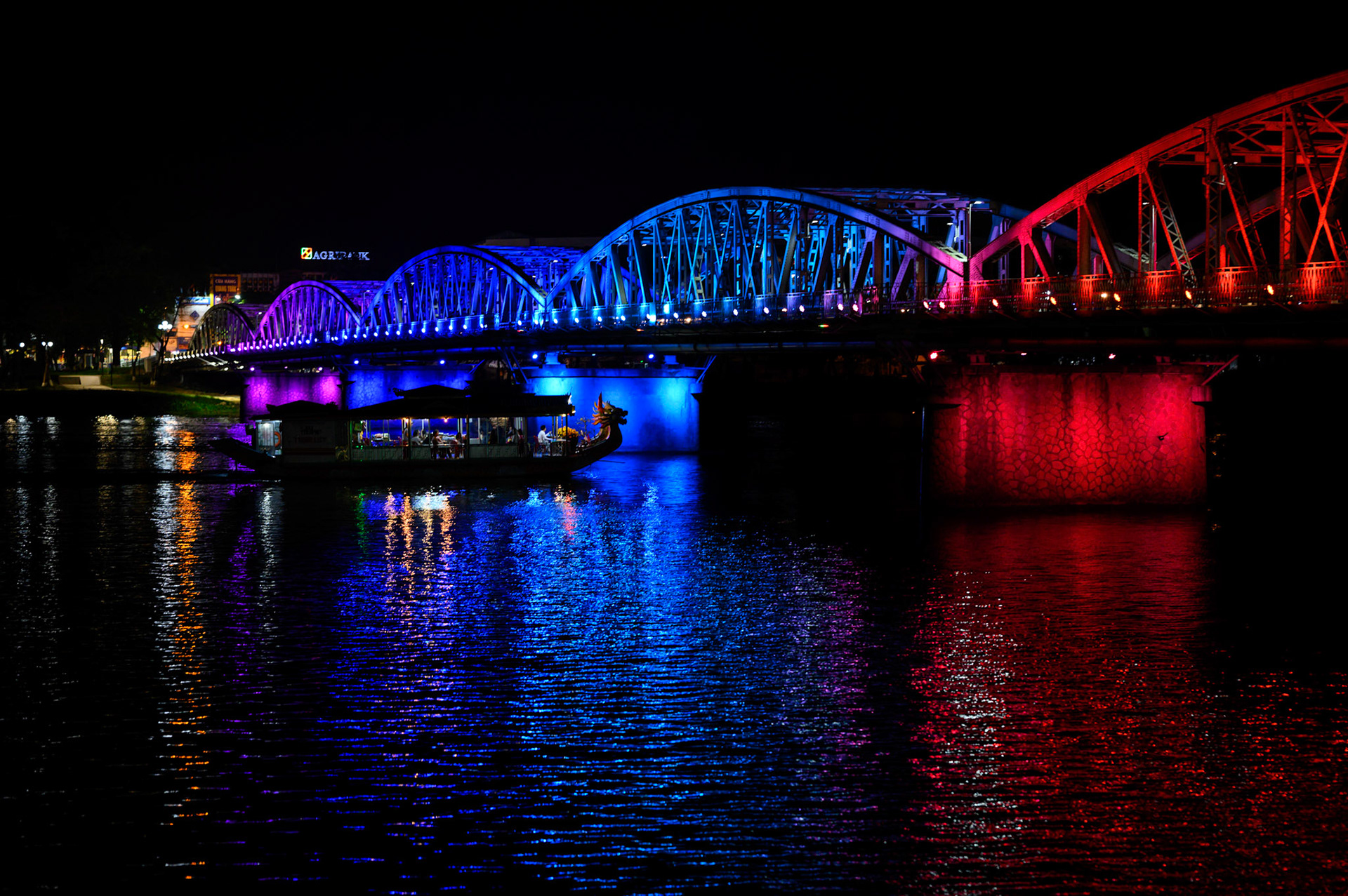 The Hue bridge lights the Perfume River at night.