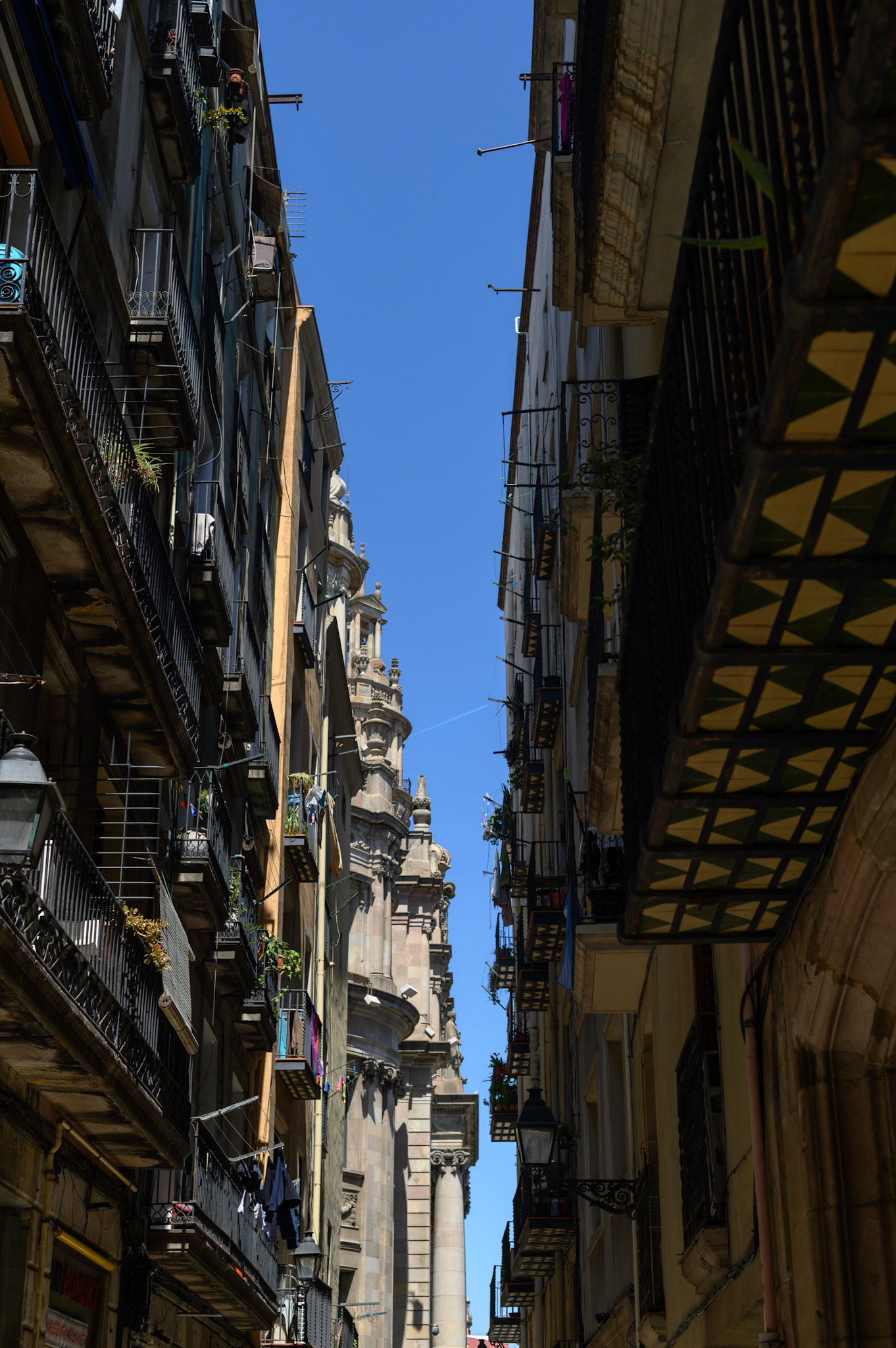 Barcelona is a densely populated city (16,500/sq km, according to wikipedia) squeezed between mountains and the sea. It's streets are canyons. But for all that it maintains a very livable feel. Whether by intent or by temperament, the city works.