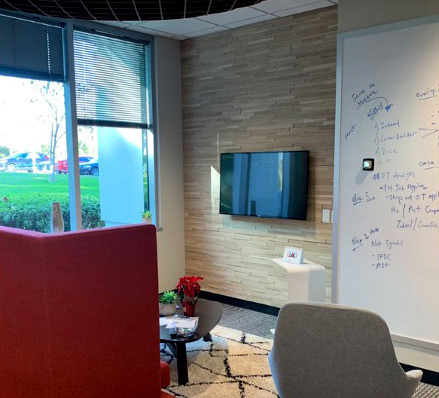 Textured wall, furniture and white board – collaboration area