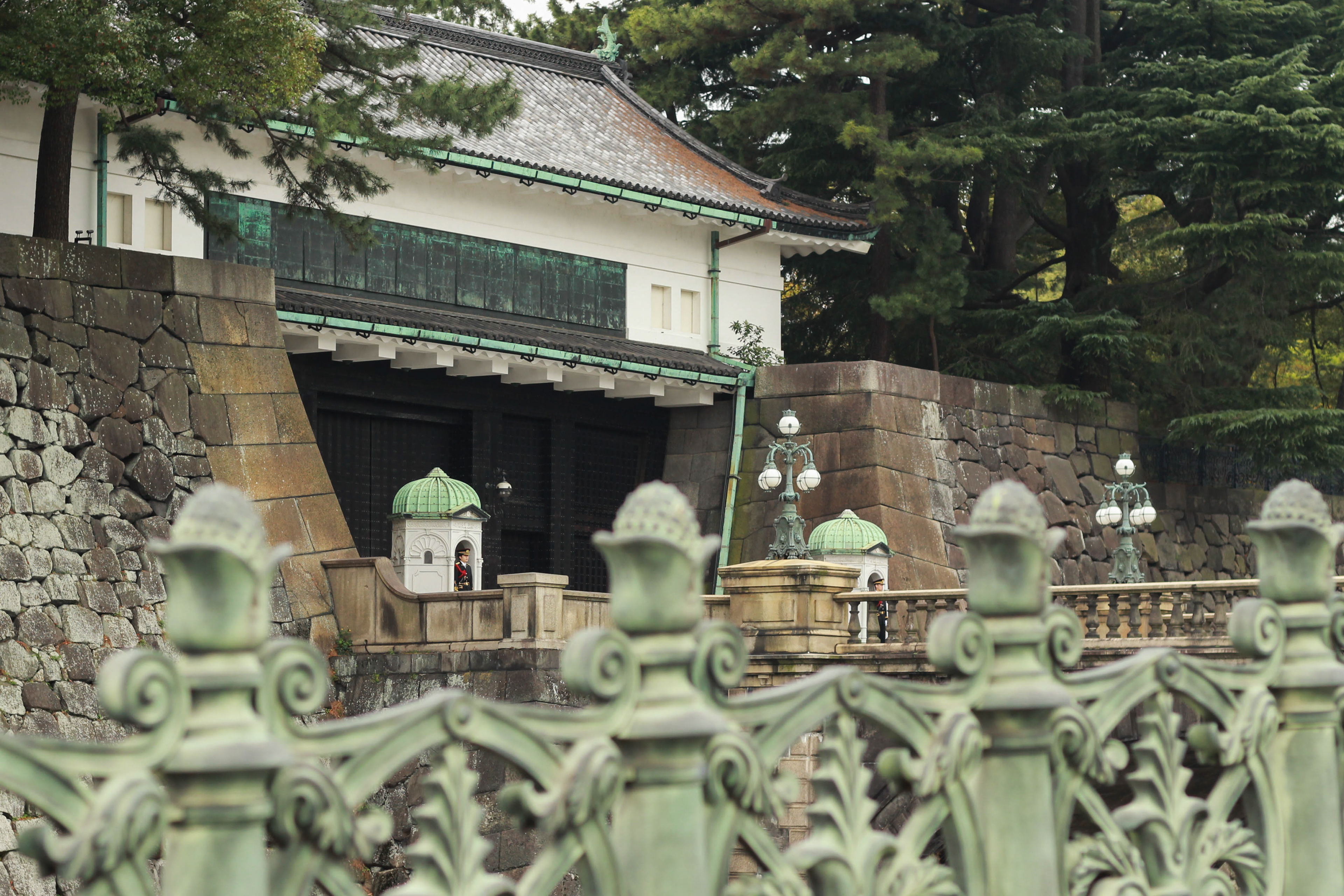 Guards stand at the Tokyo Imperial Palace.
