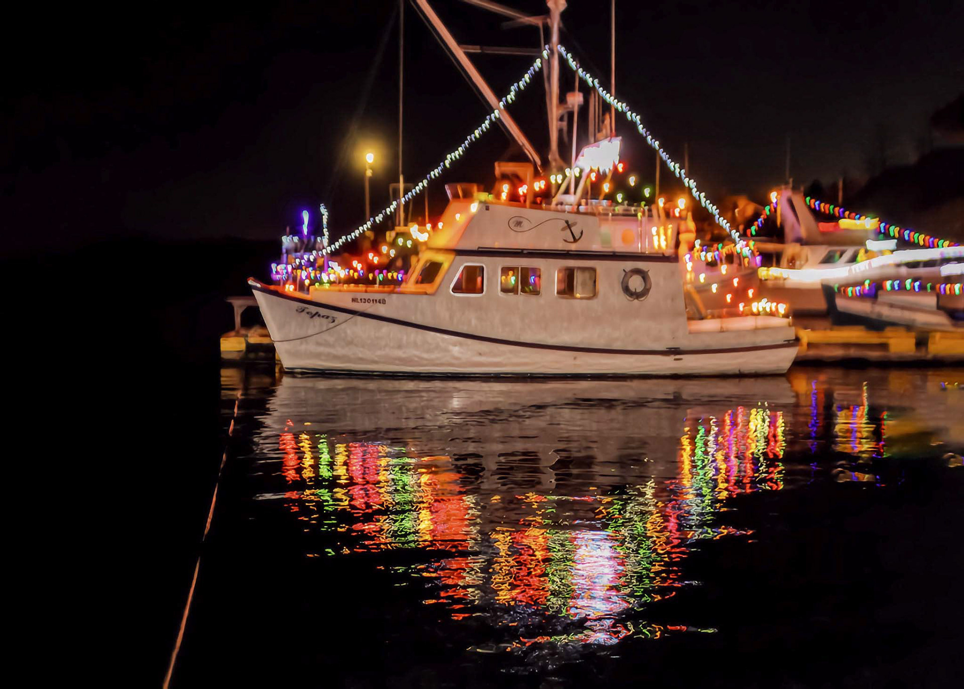 Boats decorated dockside in Port-de-Grave Christmas in the Harbour event