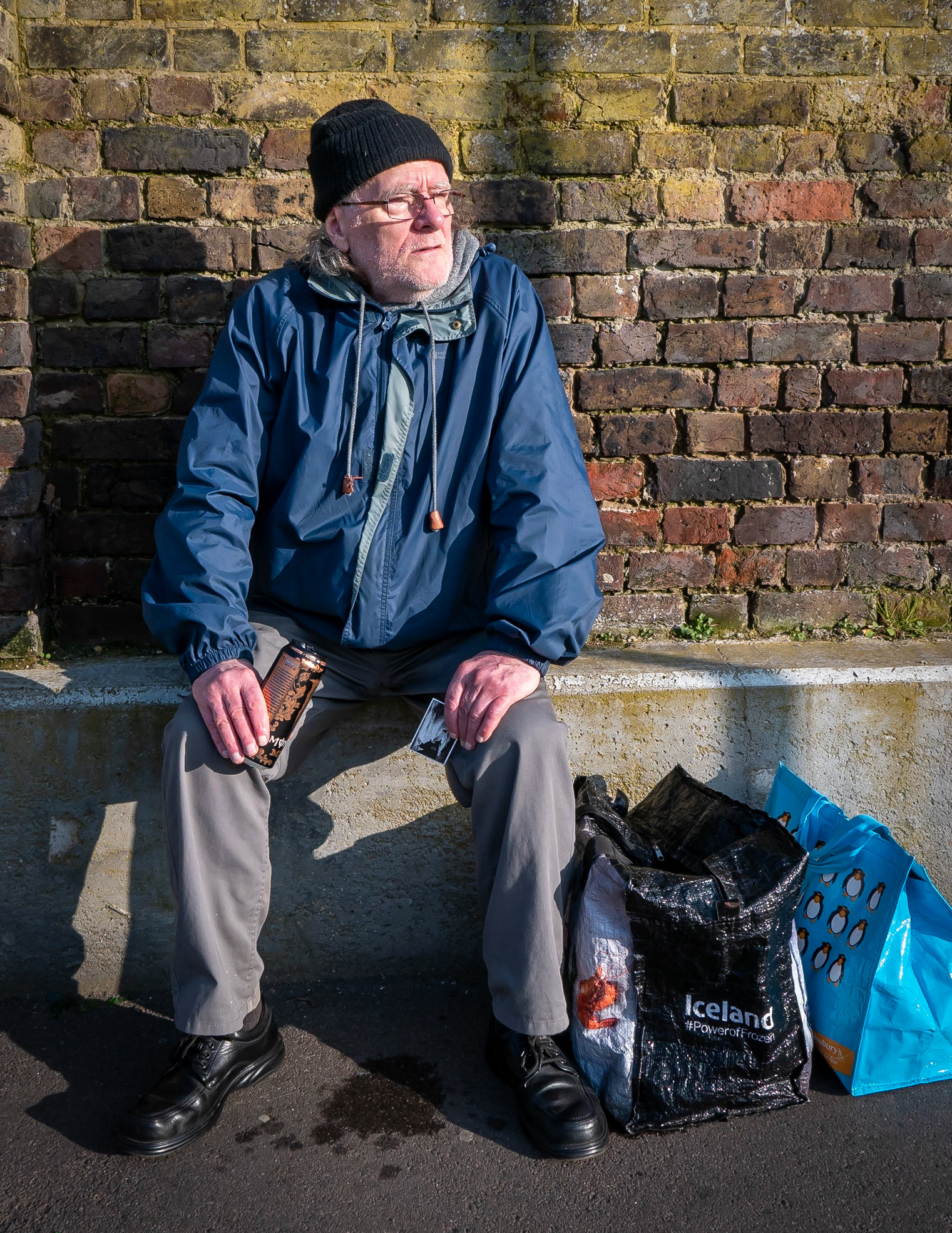 Ian taking a break from his shopping. Ian is a factory worker, kitchen porter and railway safety harness tester. He has lived in Deal for 65 years.