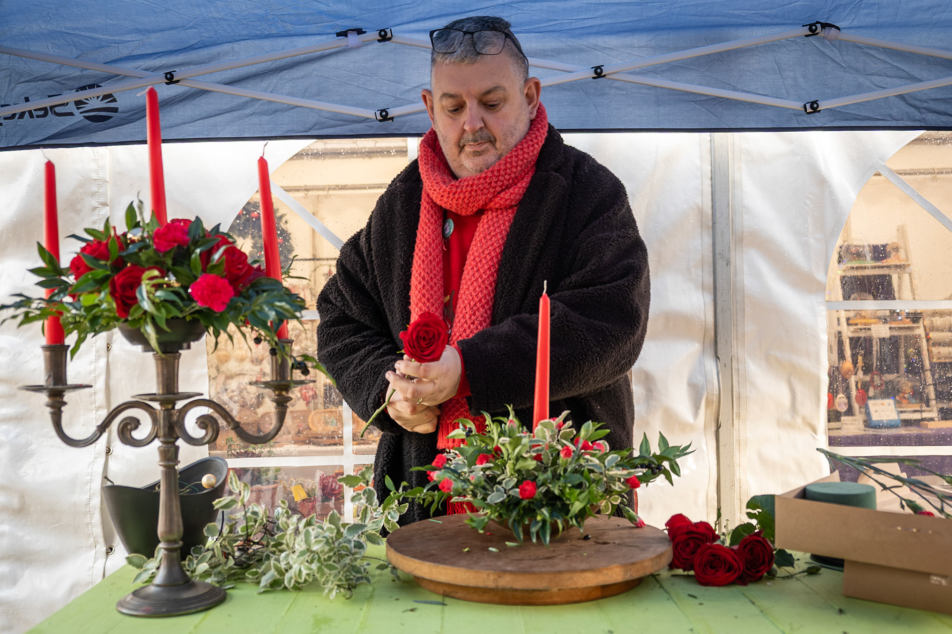 Mig Kimpton arranging Christmas floral table displays at his Frost Fair at Little Mongeham. Saturday, 6th December, 2025. Mig spent over 30 years in the theatre, from tearing tickets to managing West end Theatres and many famous stars. Mig's passion for flowers has won him many awards including 12 prestigeous medals at the RHS Chelsea Flower Show.